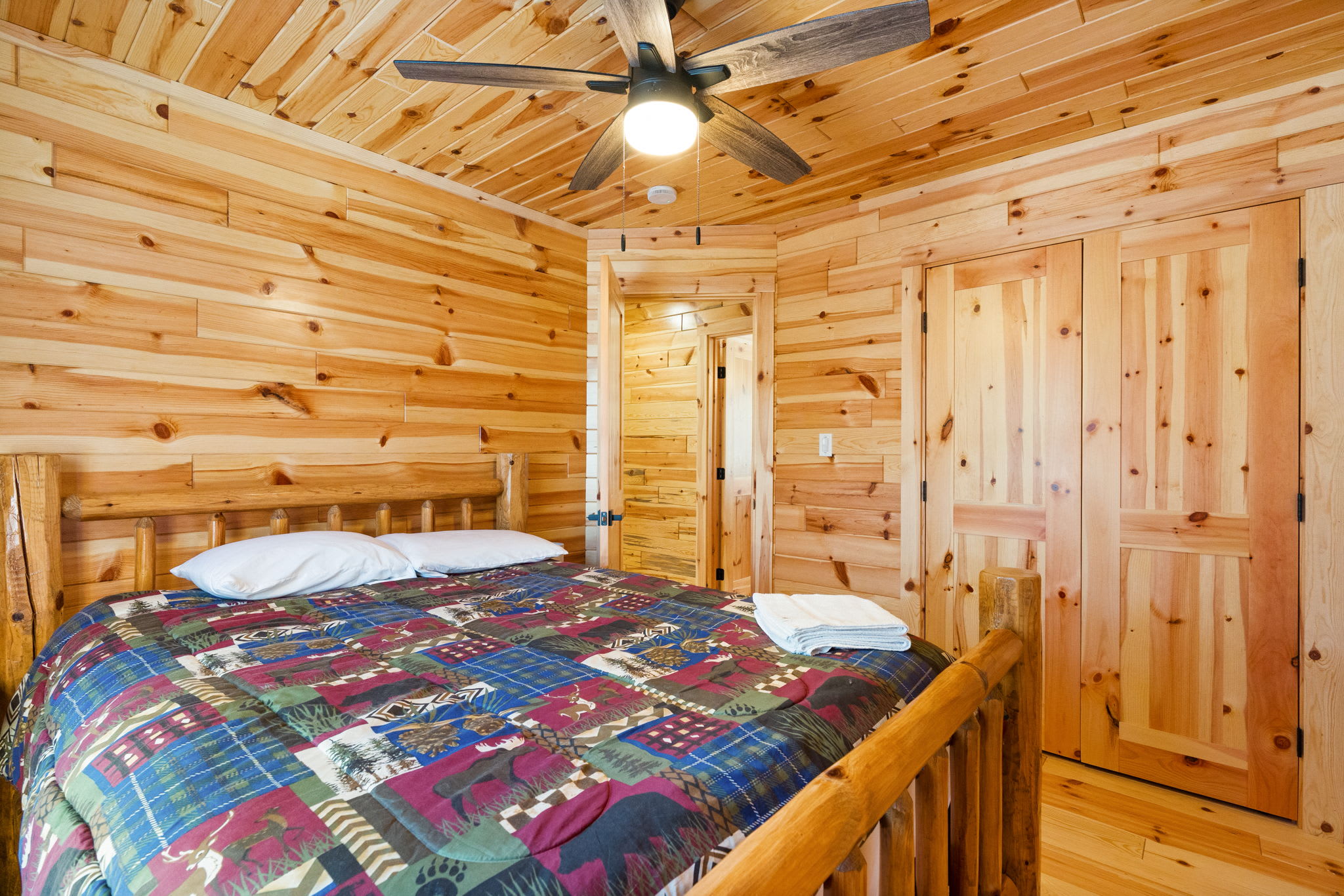 Each bedroom offers its own cozy cabin vibe with handcrafted bedding and wood accents