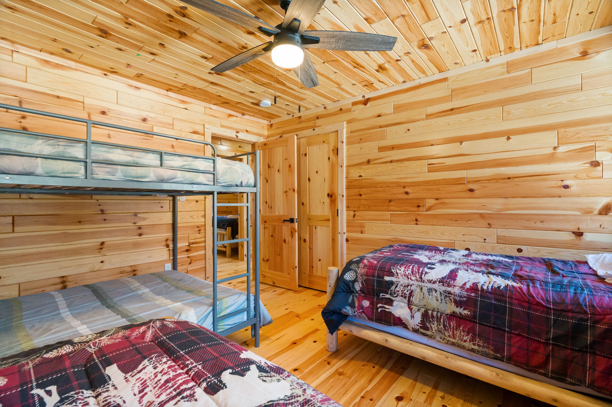 Sturdy wooden bunk beds and log cabin walls make bedtime an adventure