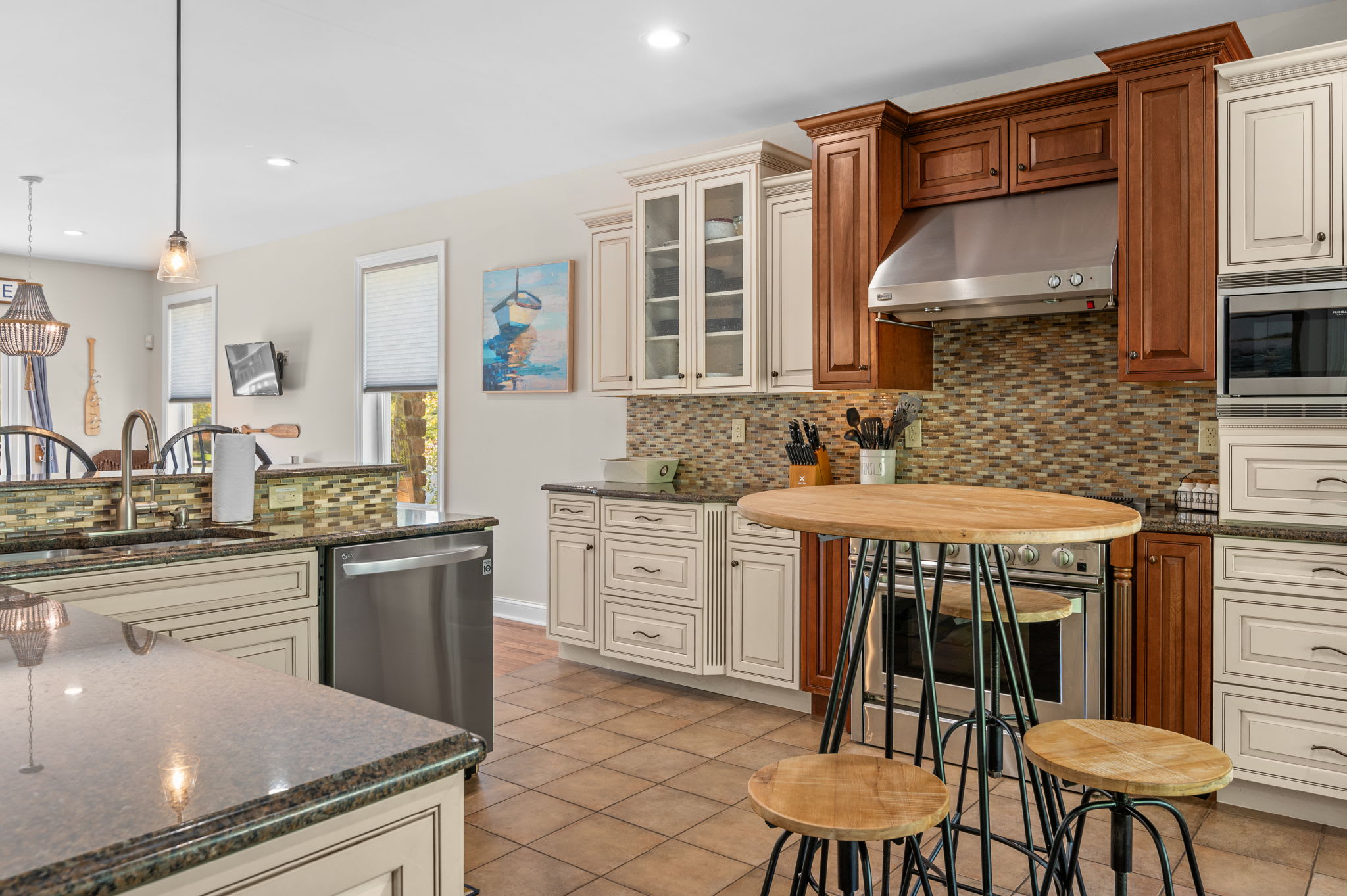 Cook together in the fully equipped kitchen with island seating and granite counters