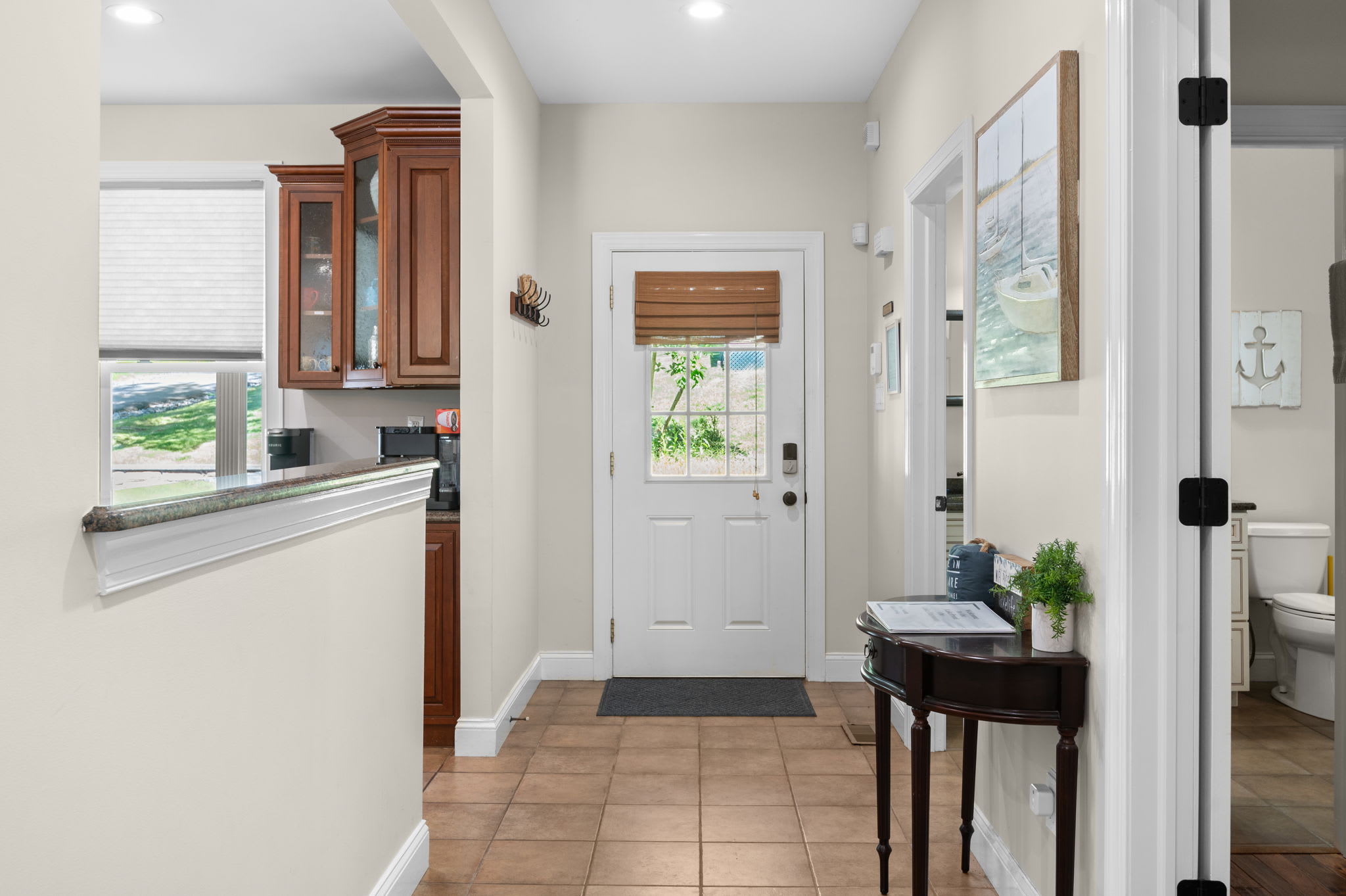 Step inside the welcoming entryway with charming nautical touches throughout