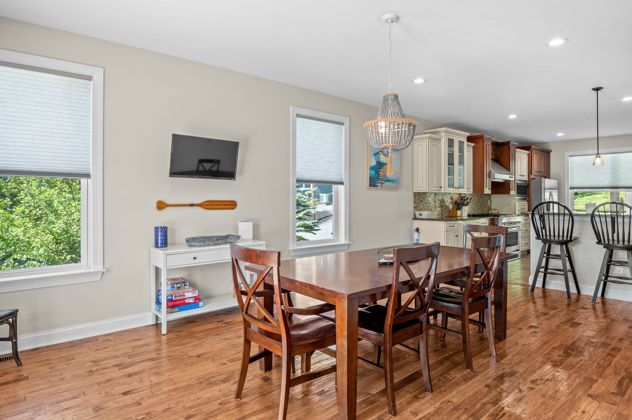Dining area with board games, TV, and easy access to the kitchen and living room
