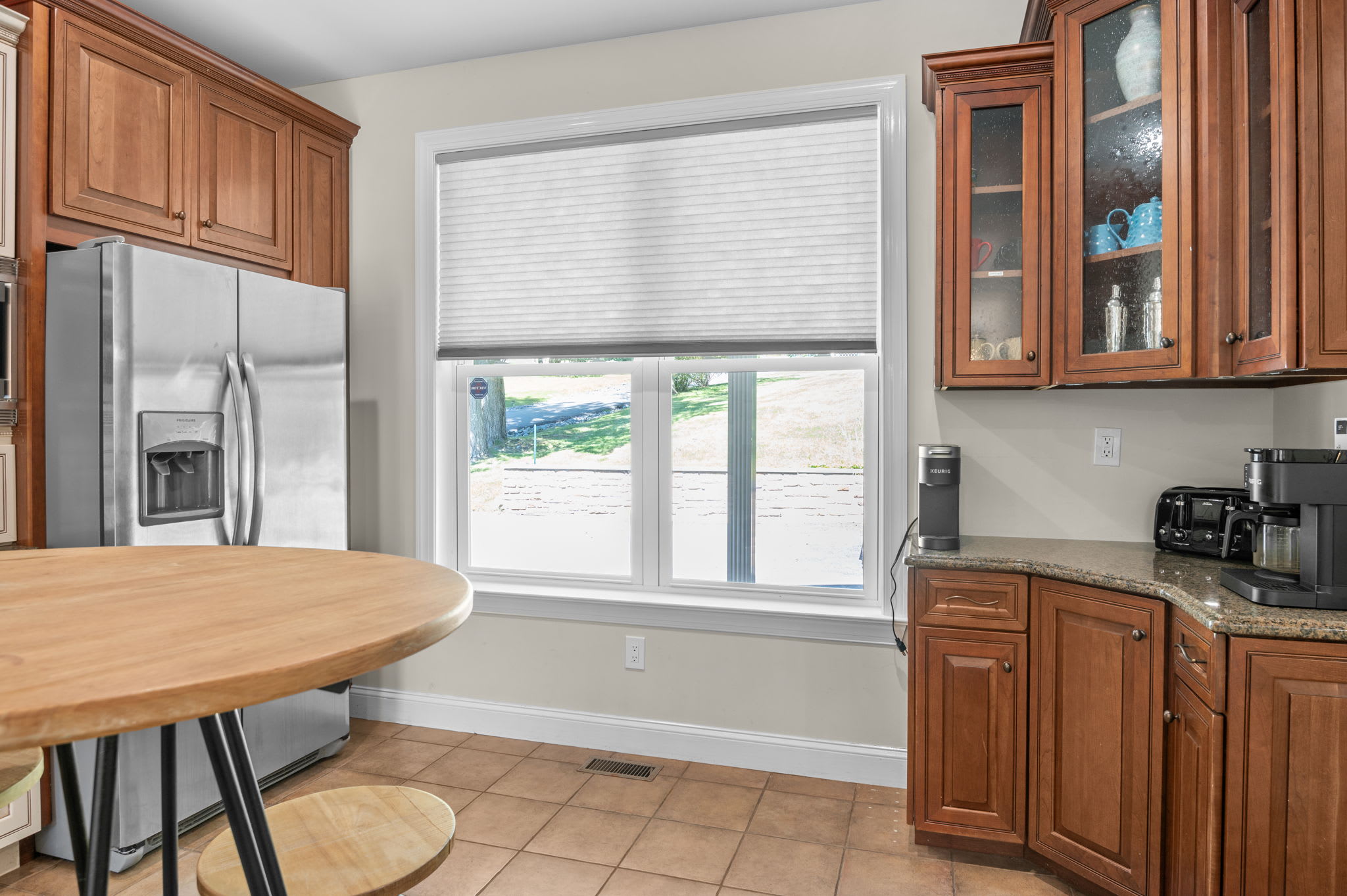 Coffee station and stainless fridge ready for slow mornings at the lake