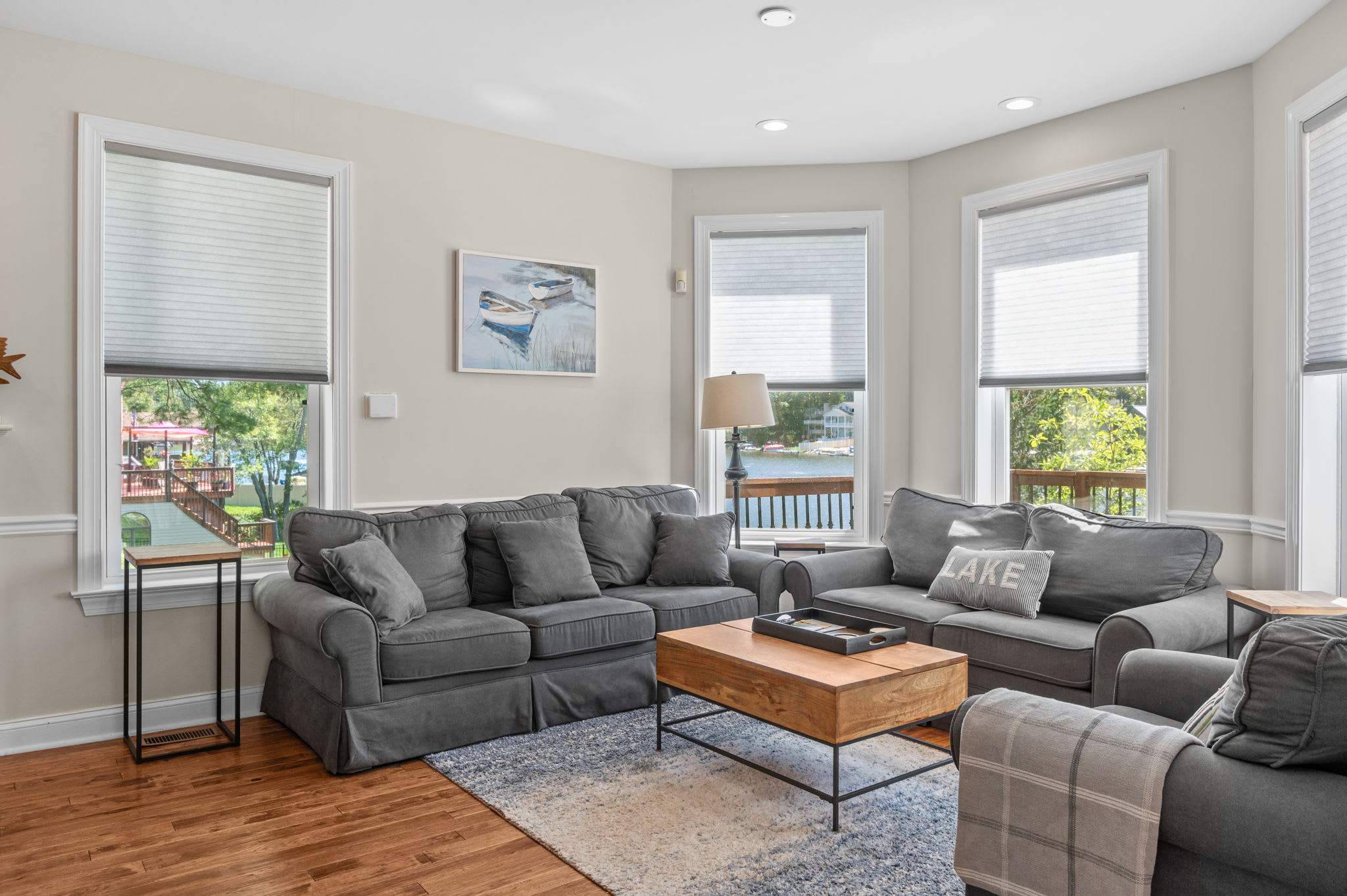 Sink into the sofas and enjoy lake views through the bay windows in the living room