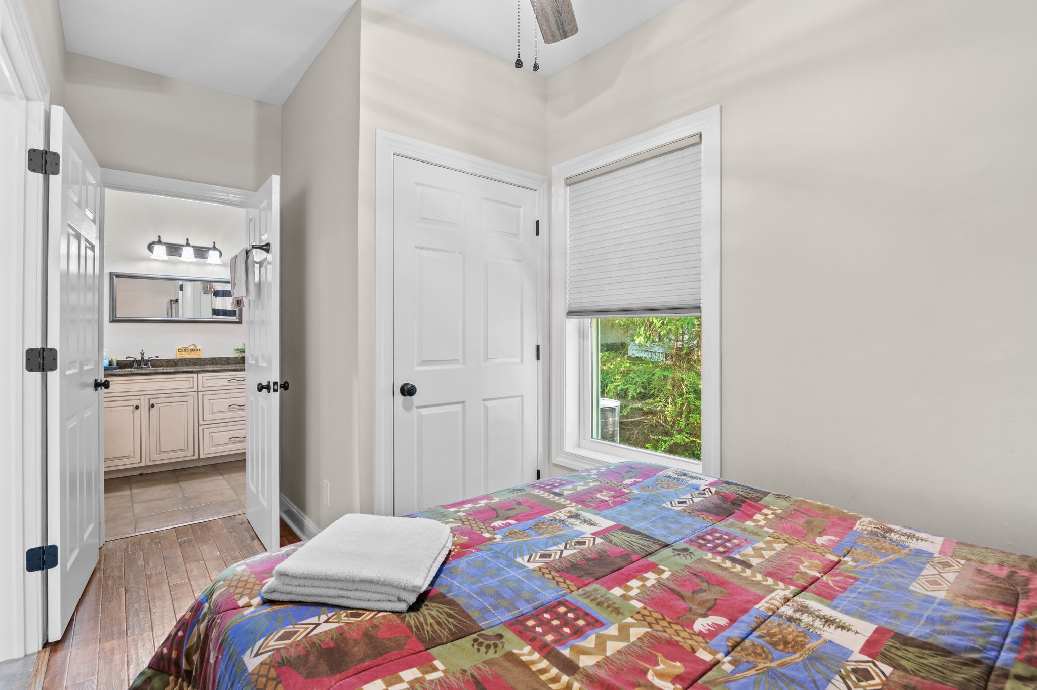 This charming bedroom opens to a bathroom for added convenience