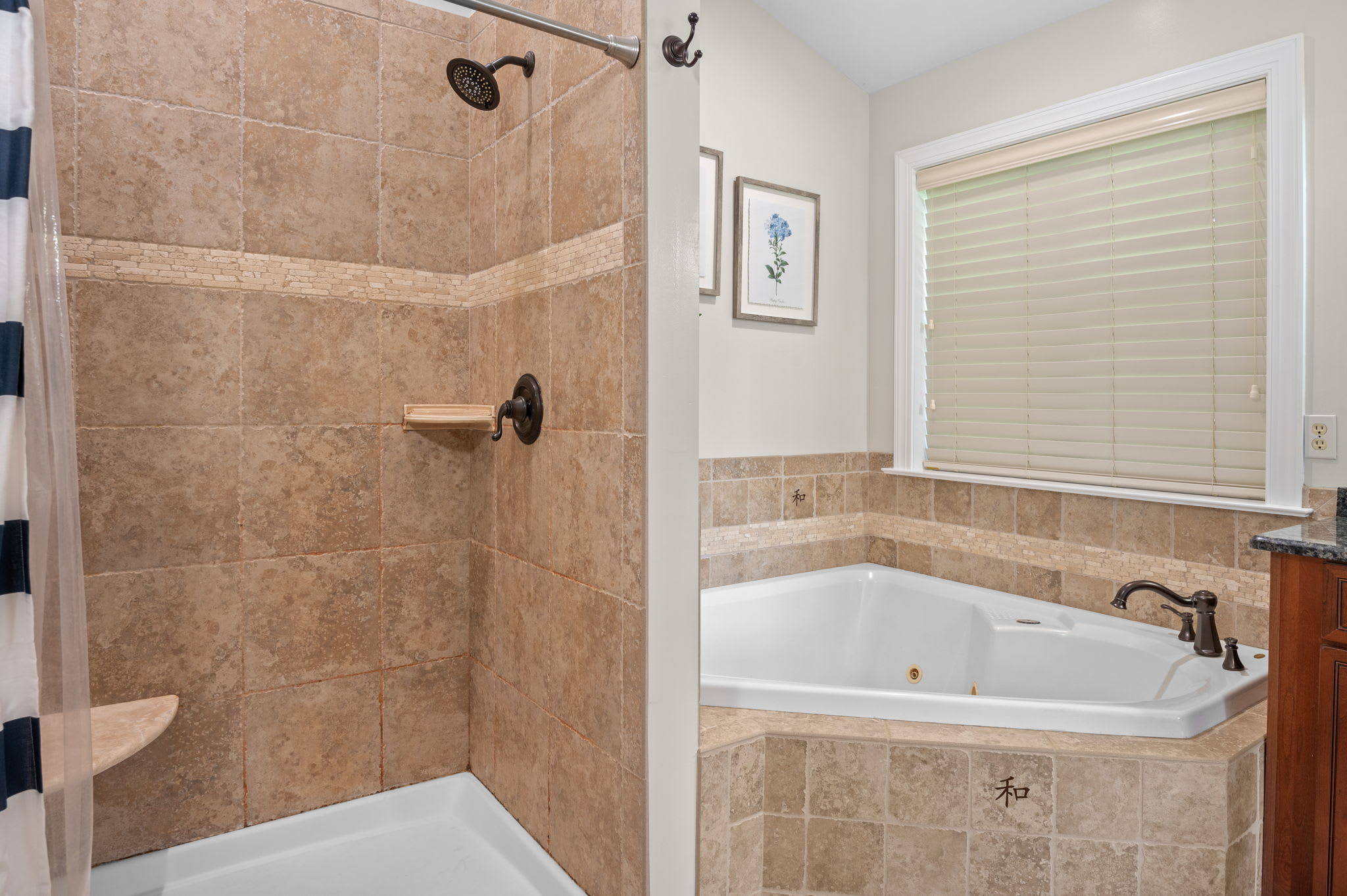 Soak in the tub or rinse off in the tiled shower in the master bathroom