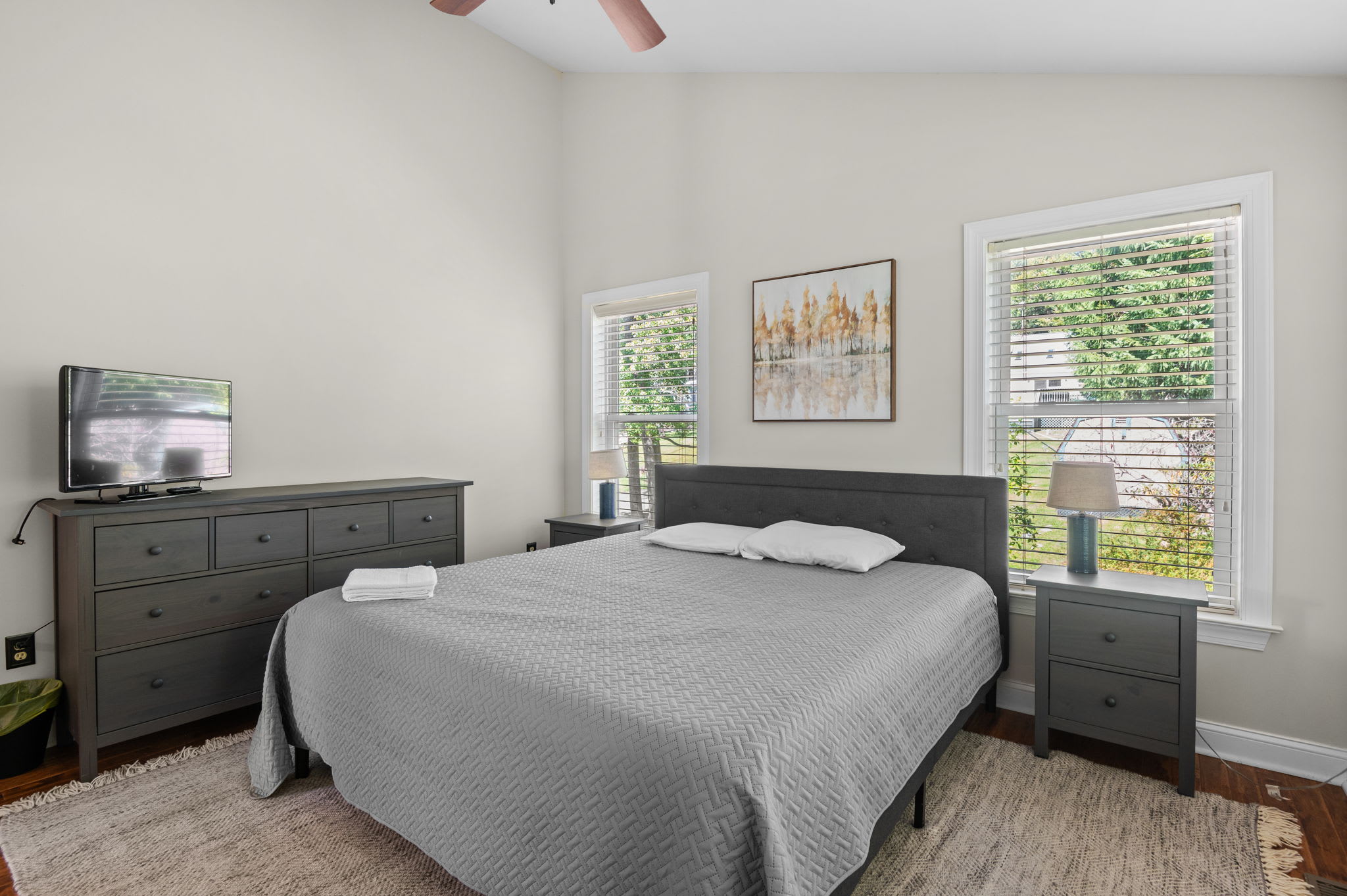 Comfortable bedroom with a bed, matching nightstands, and soft natural light