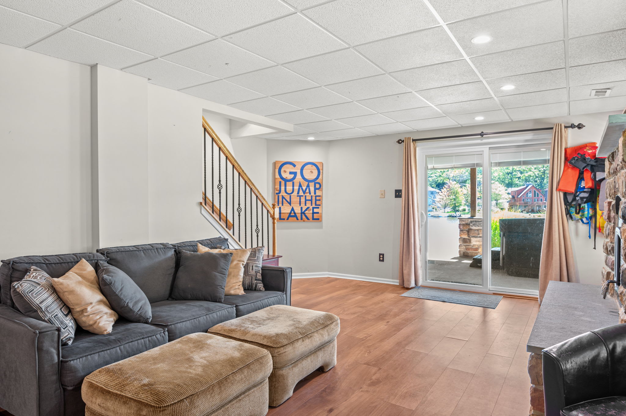 Spacious game room with sectional seating, TV, and room for the whole group