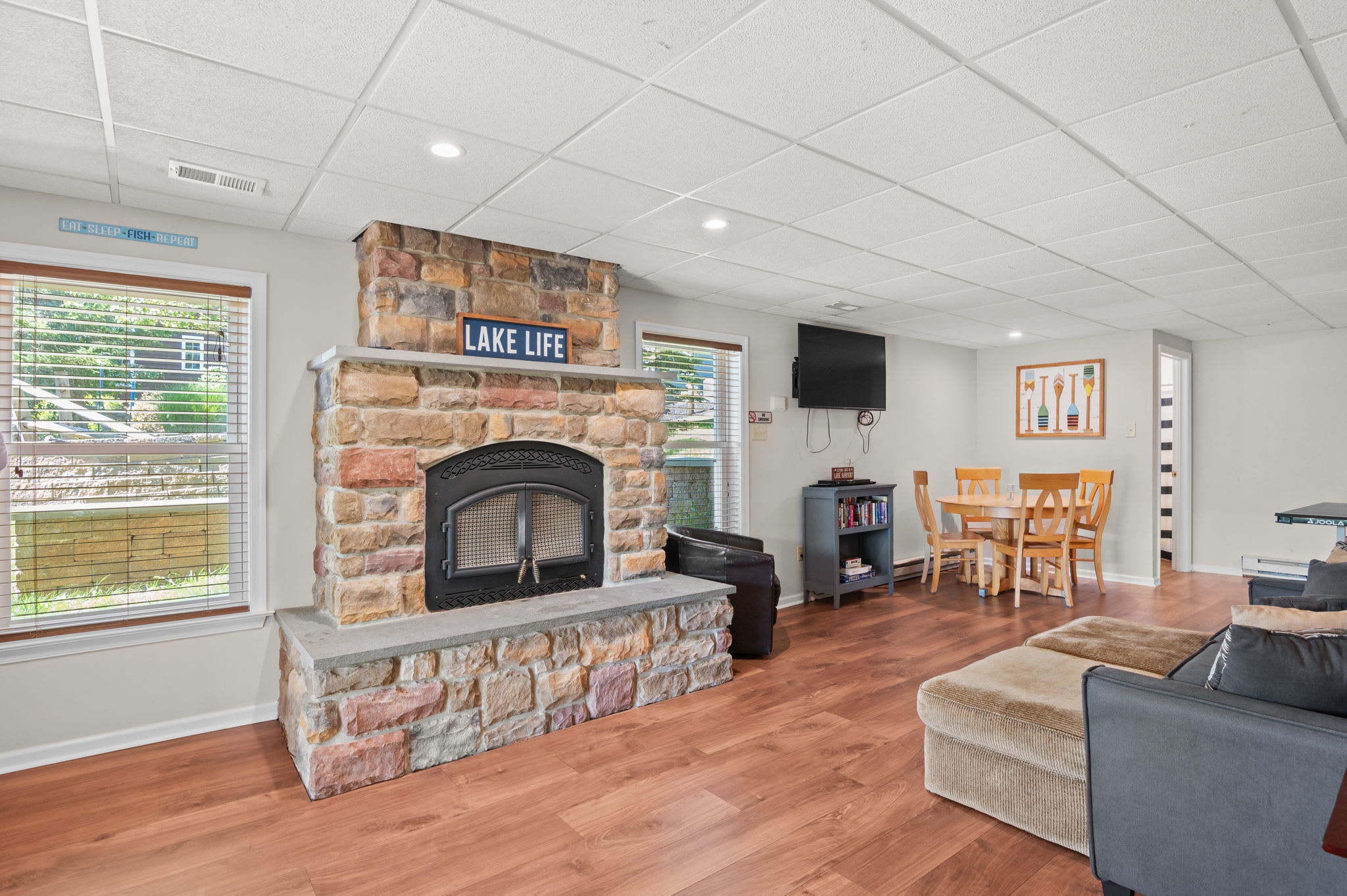 Hang out in the game room with a stone fireplace, TV, and plenty of seating