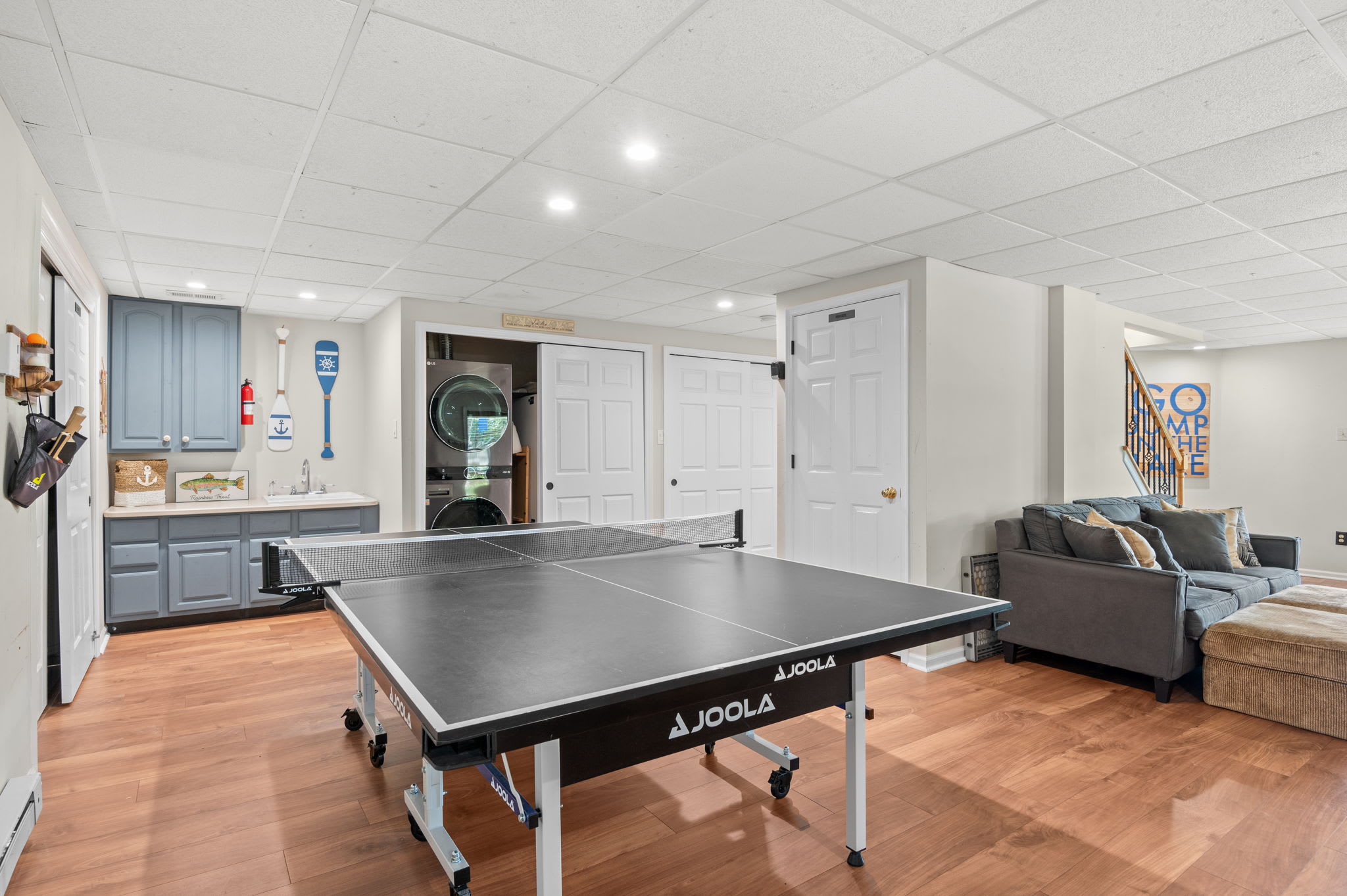 The game room offers ping pong, a fireplace, and a cozy sectional for downtime