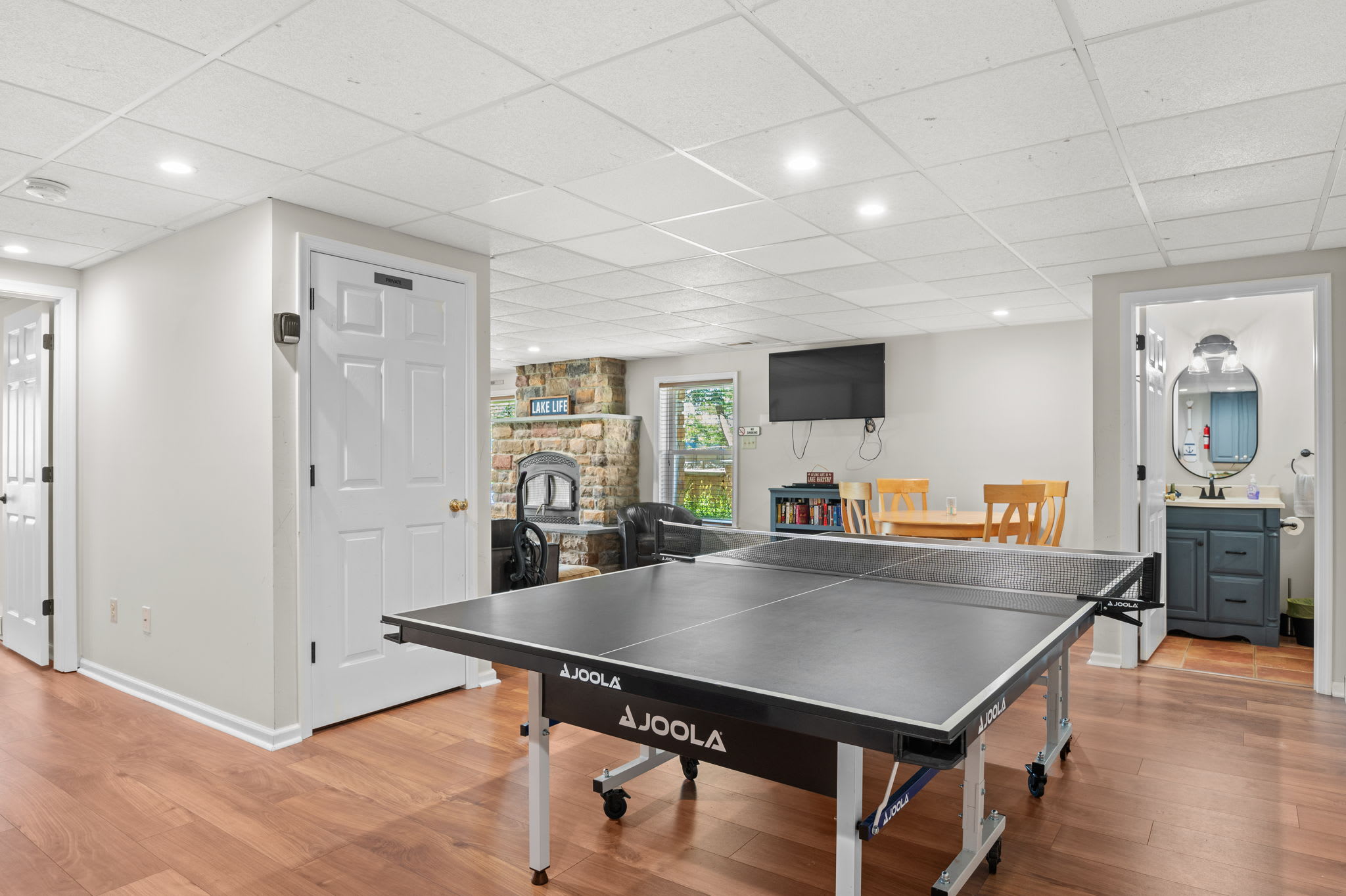 Ping pong table and wet bar keep the fun going in the lower level