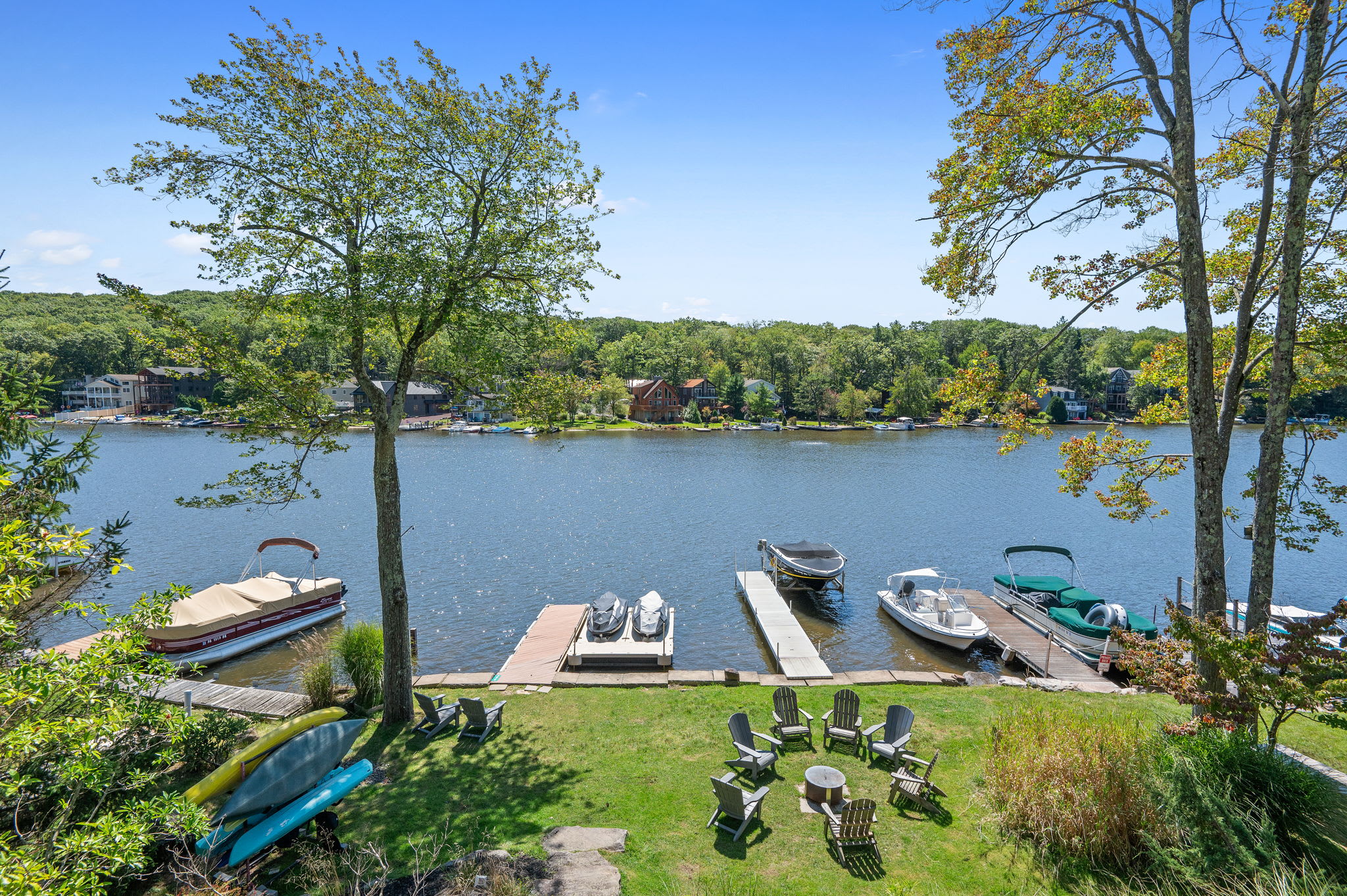 View from above showing the dock, boats, and waterfront just steps from the house