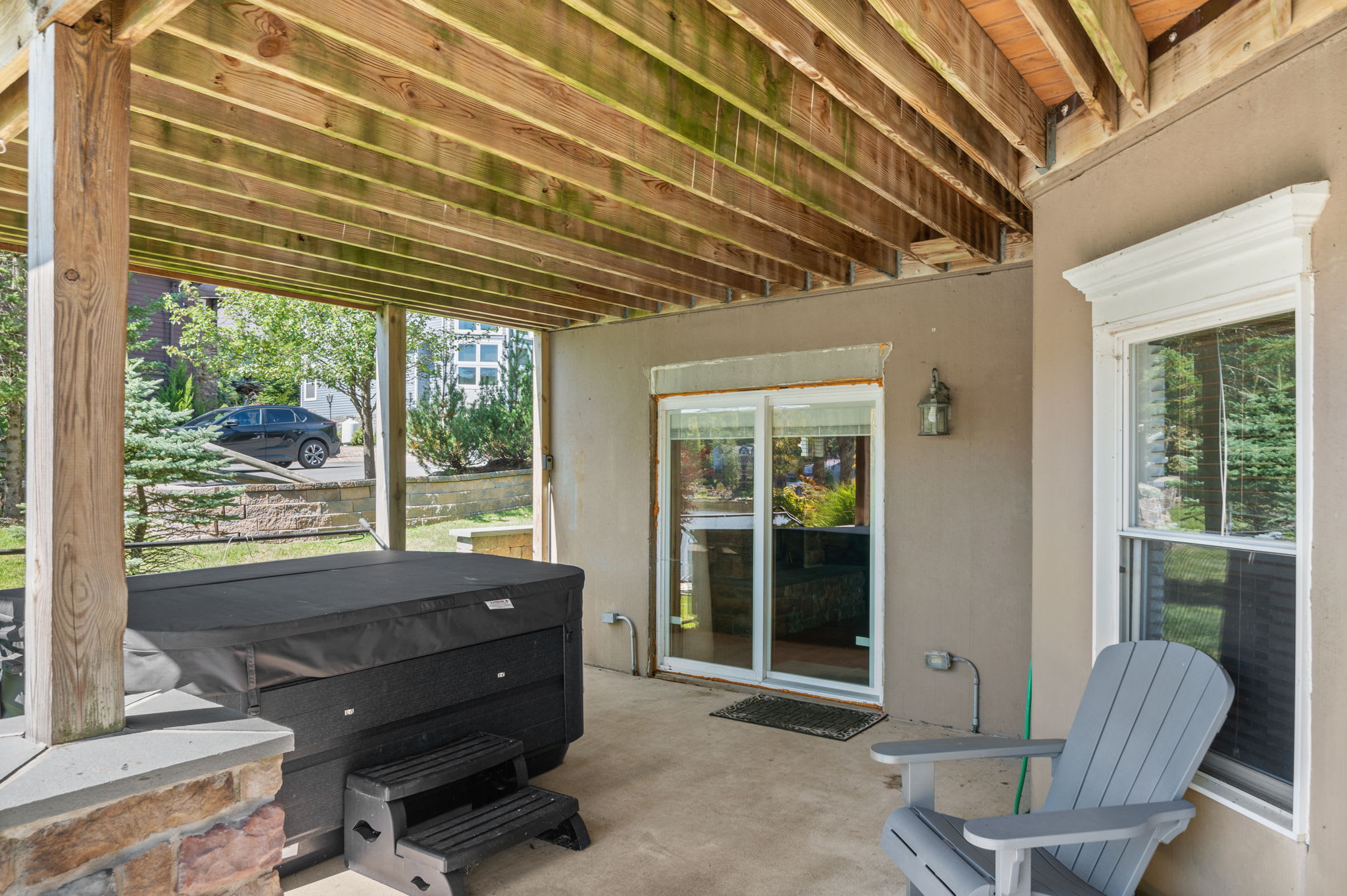 Soak under the stars in the hot tub on the covered patio with lake breezes