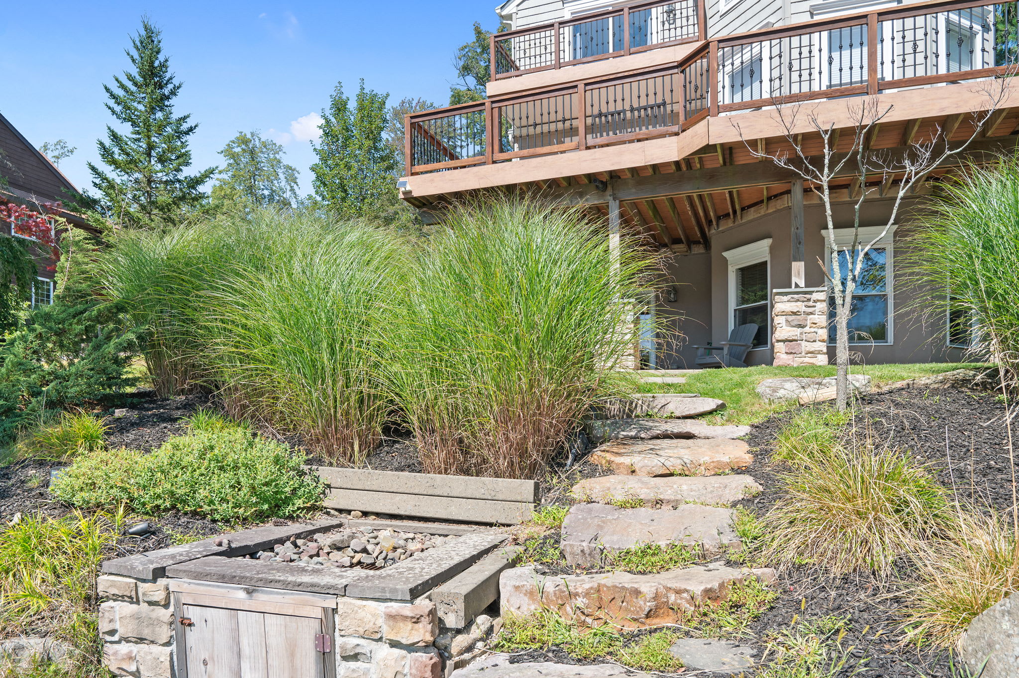 Landscaped grounds with stone accents and multiple levels to explore