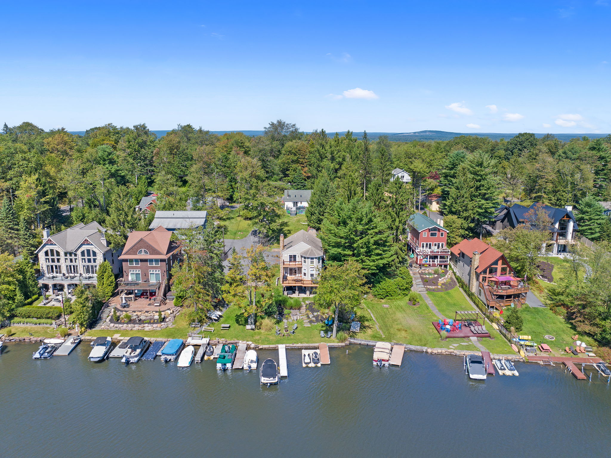Nestled among the trees with direct lake access and a vibrant waterfront community