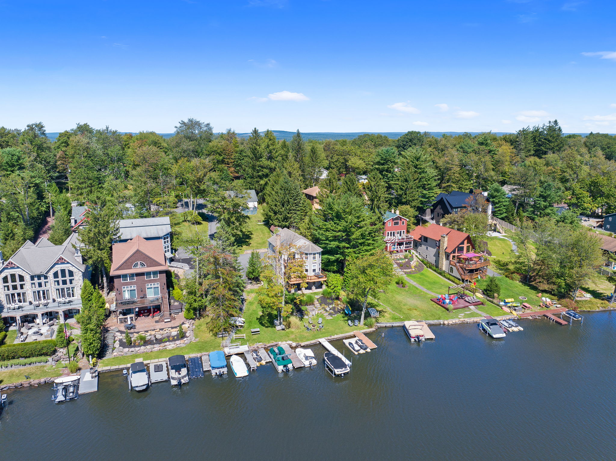 Lakefront homes line the shore with docks and boats ready for adventure