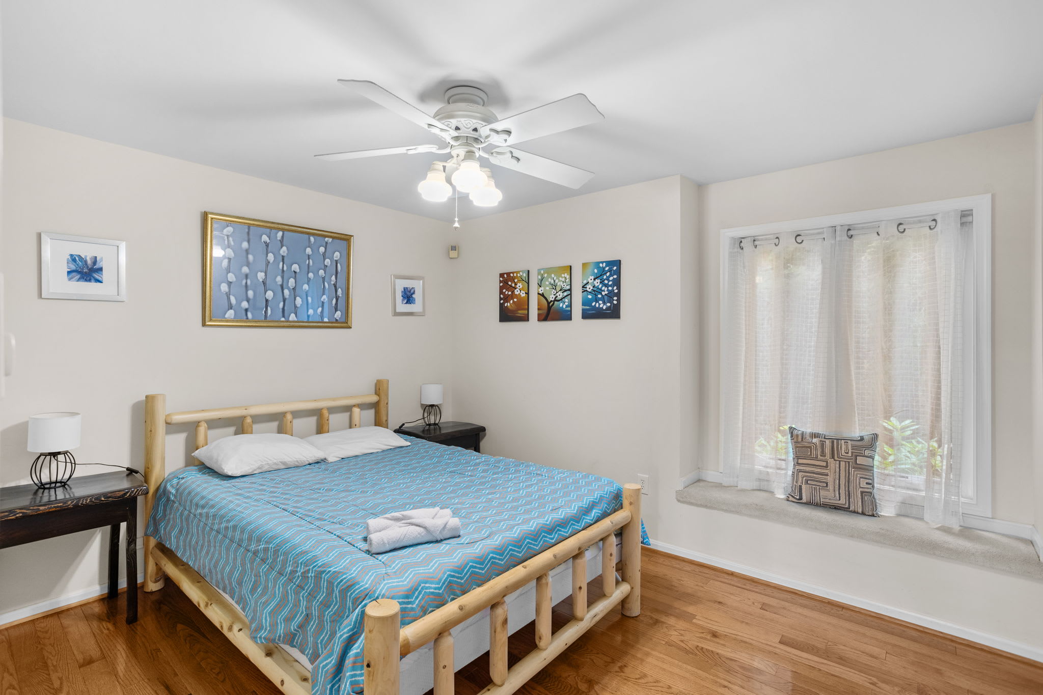 Rest easy in this bright bedroom with a comfortable bed