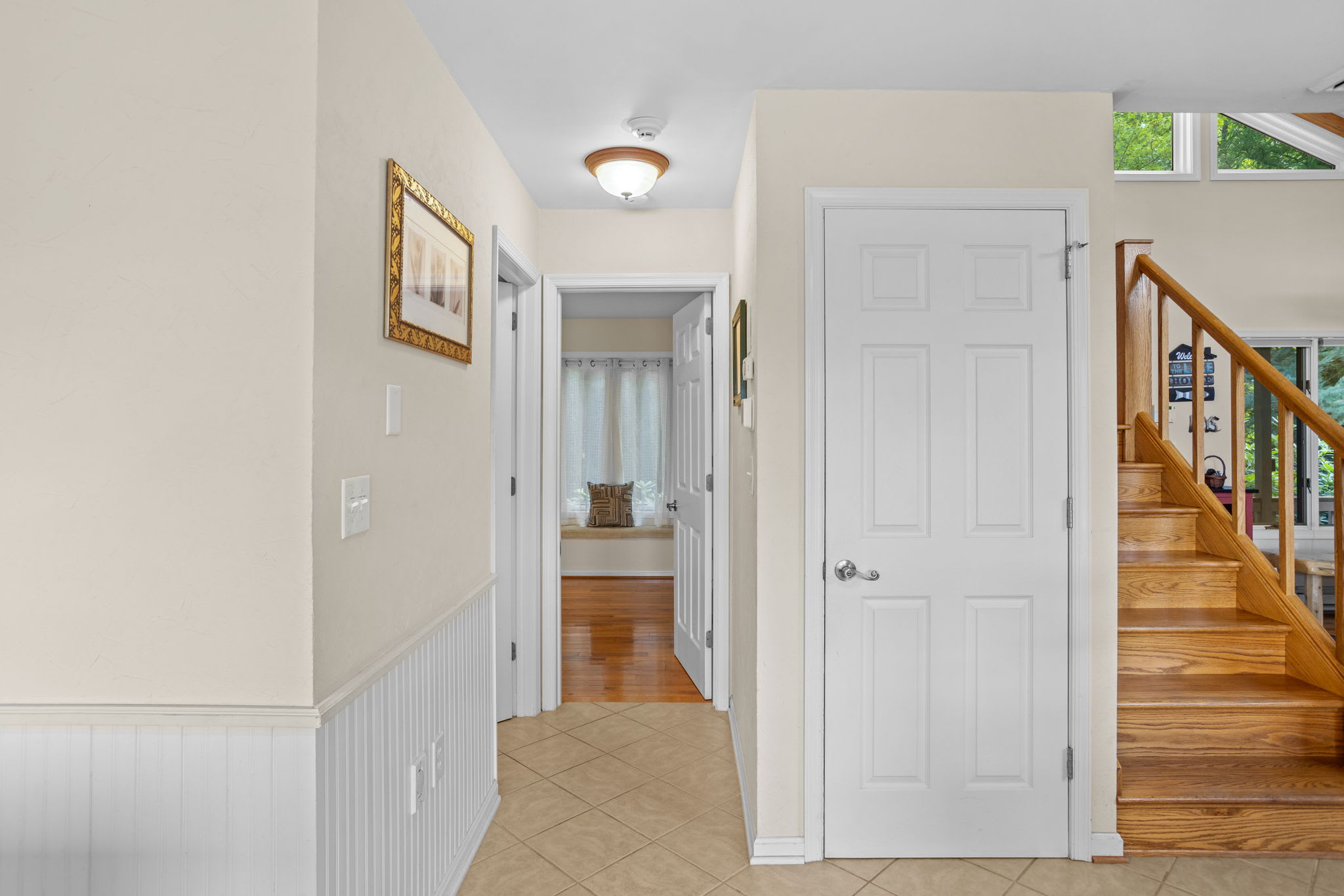 A bright hallway connecting the bedrooms and bathroom