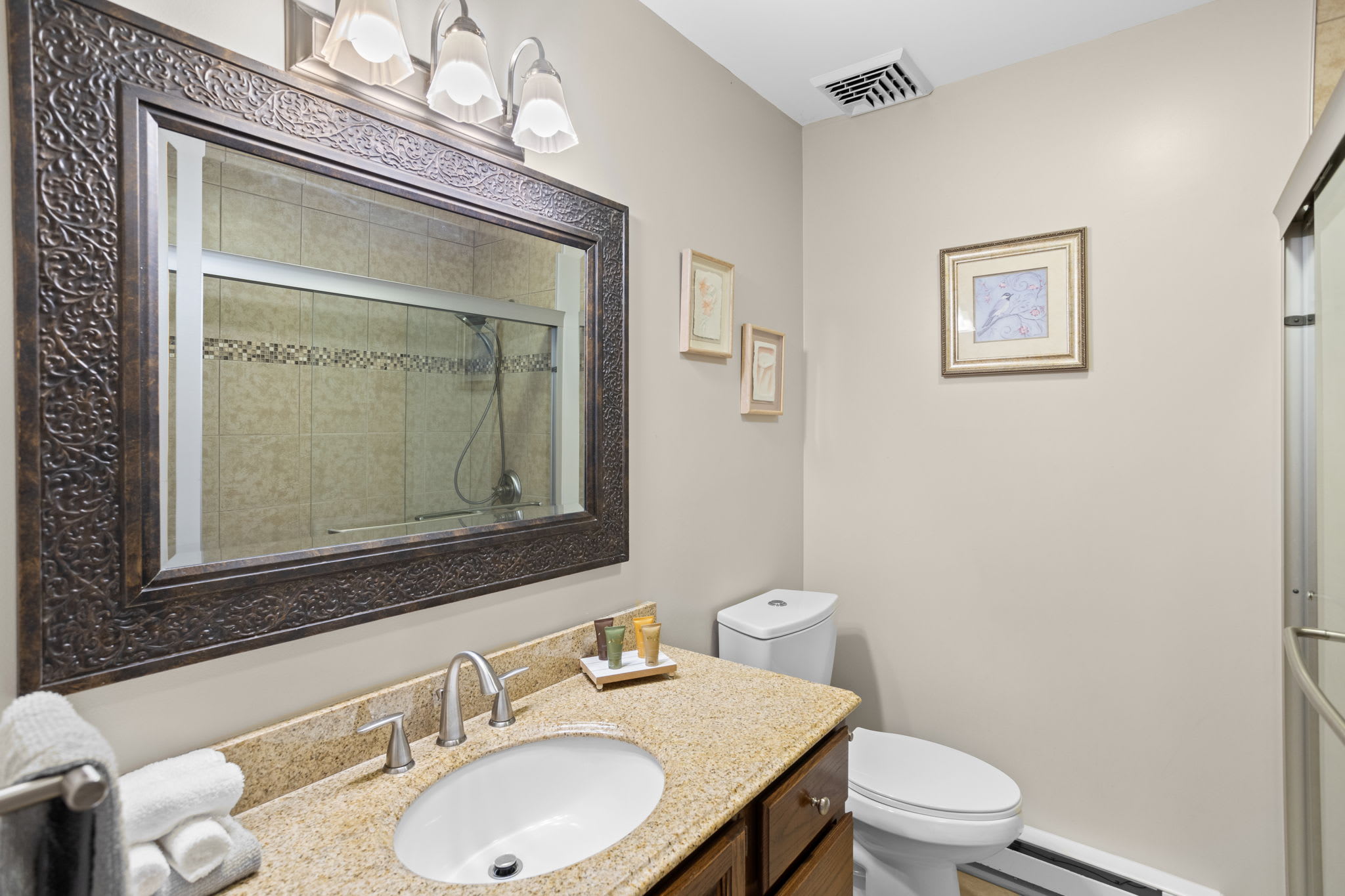 The full bathroom features a double vanity and plenty of space
