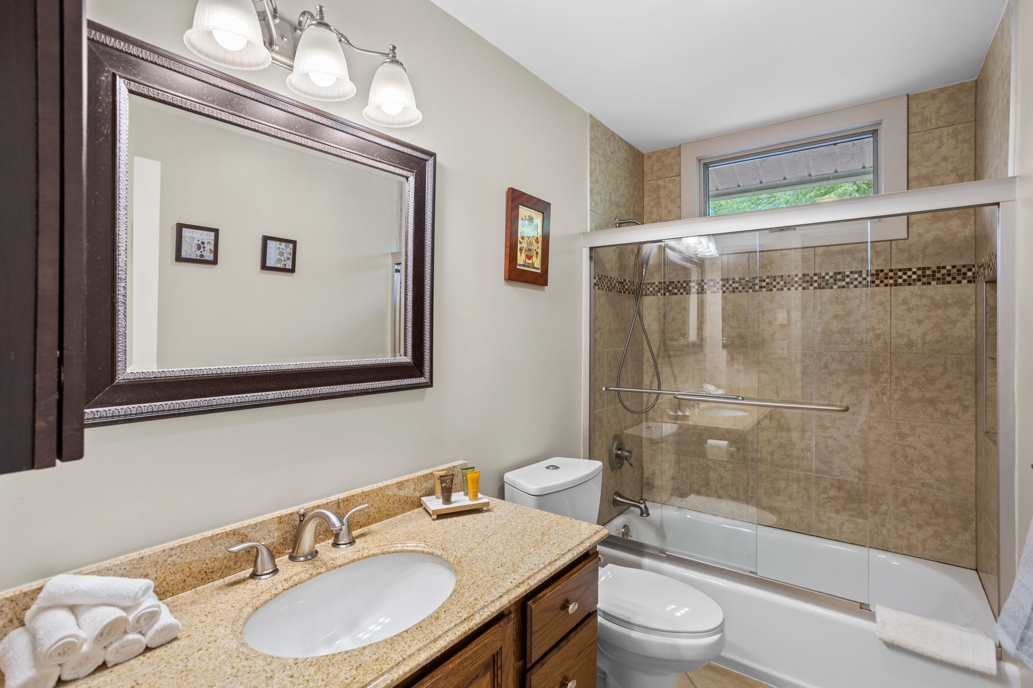 Warm tones and good lighting in this cozy bathroom