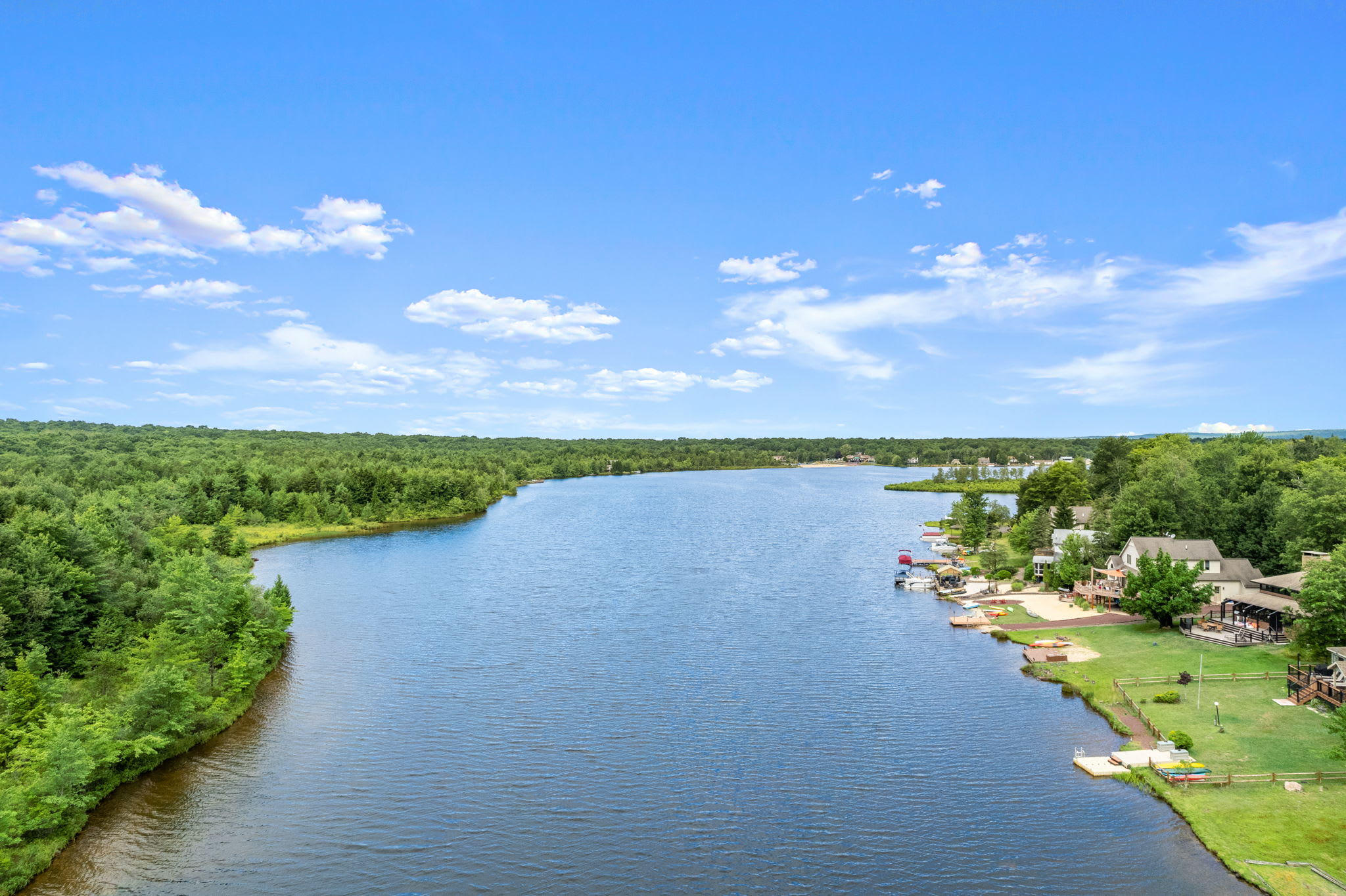 Soar above the lake and take in the beauty of the Pocono forest