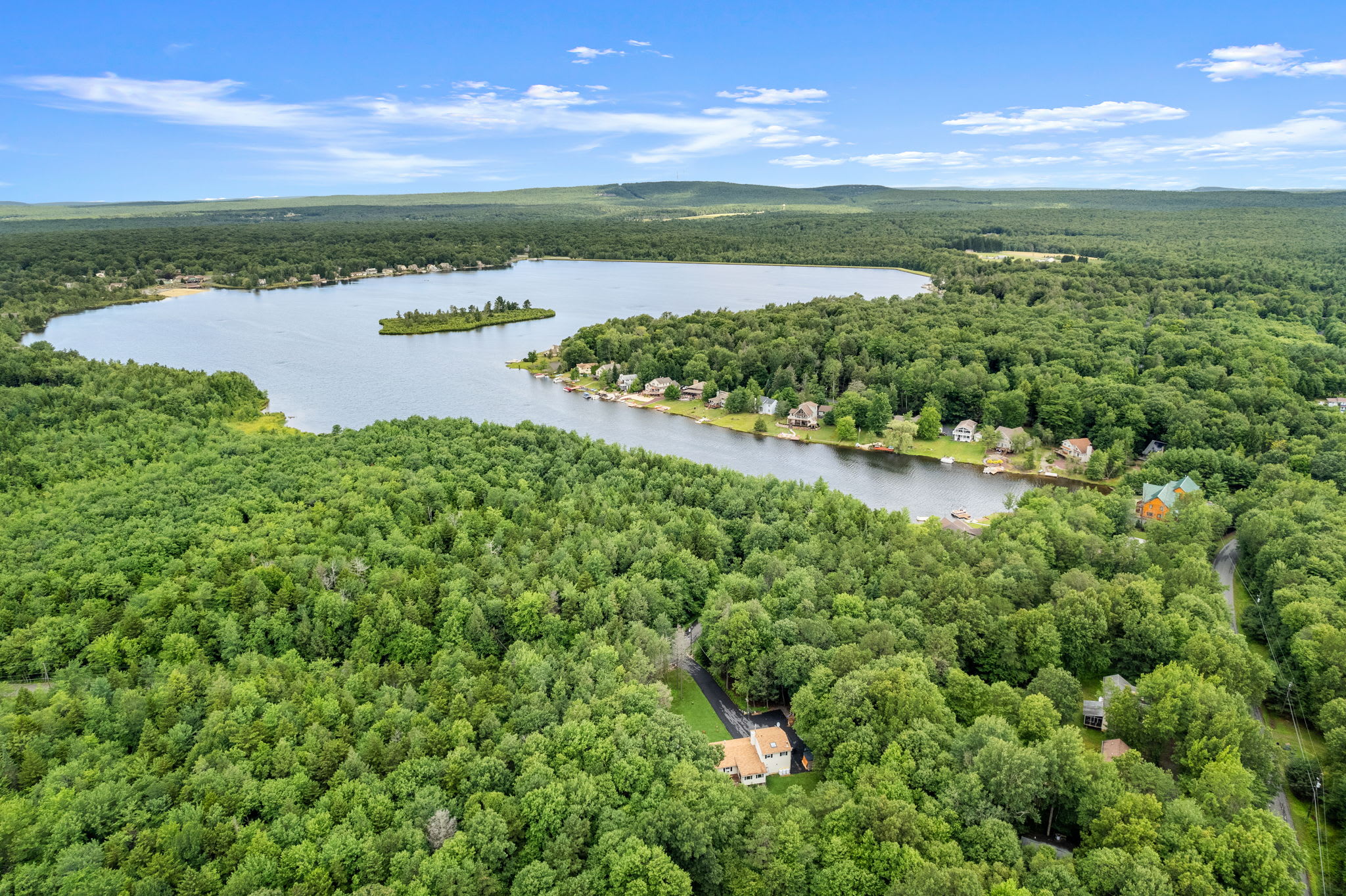 An aerial view of the stunning lake and surrounding forest