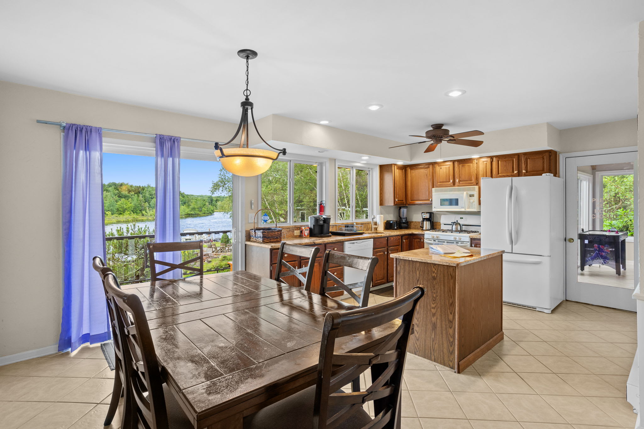 Gather around the dining table with the kitchen just steps away