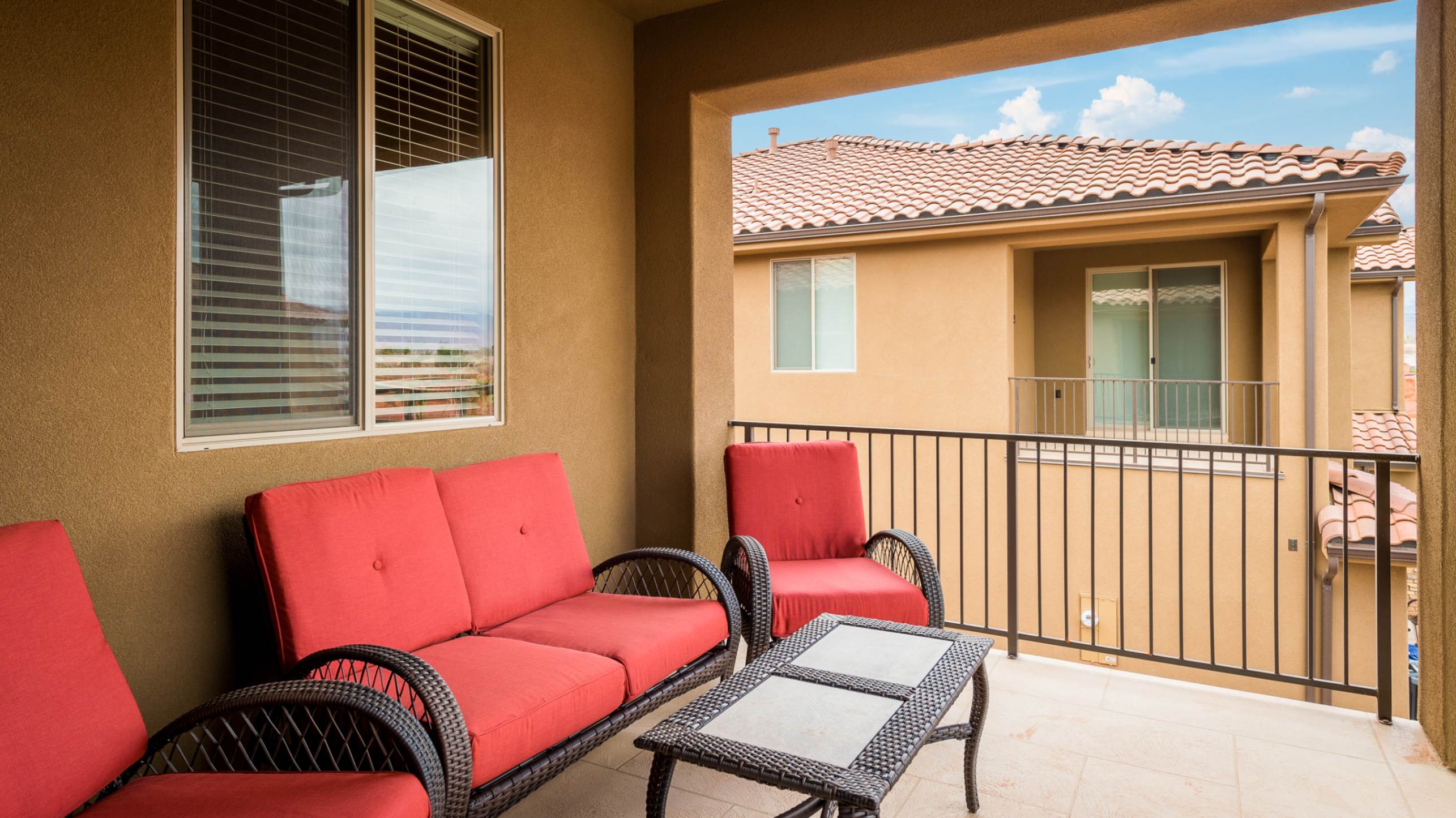 105 - Covered balcony off the upstairs family room with comfy seating
