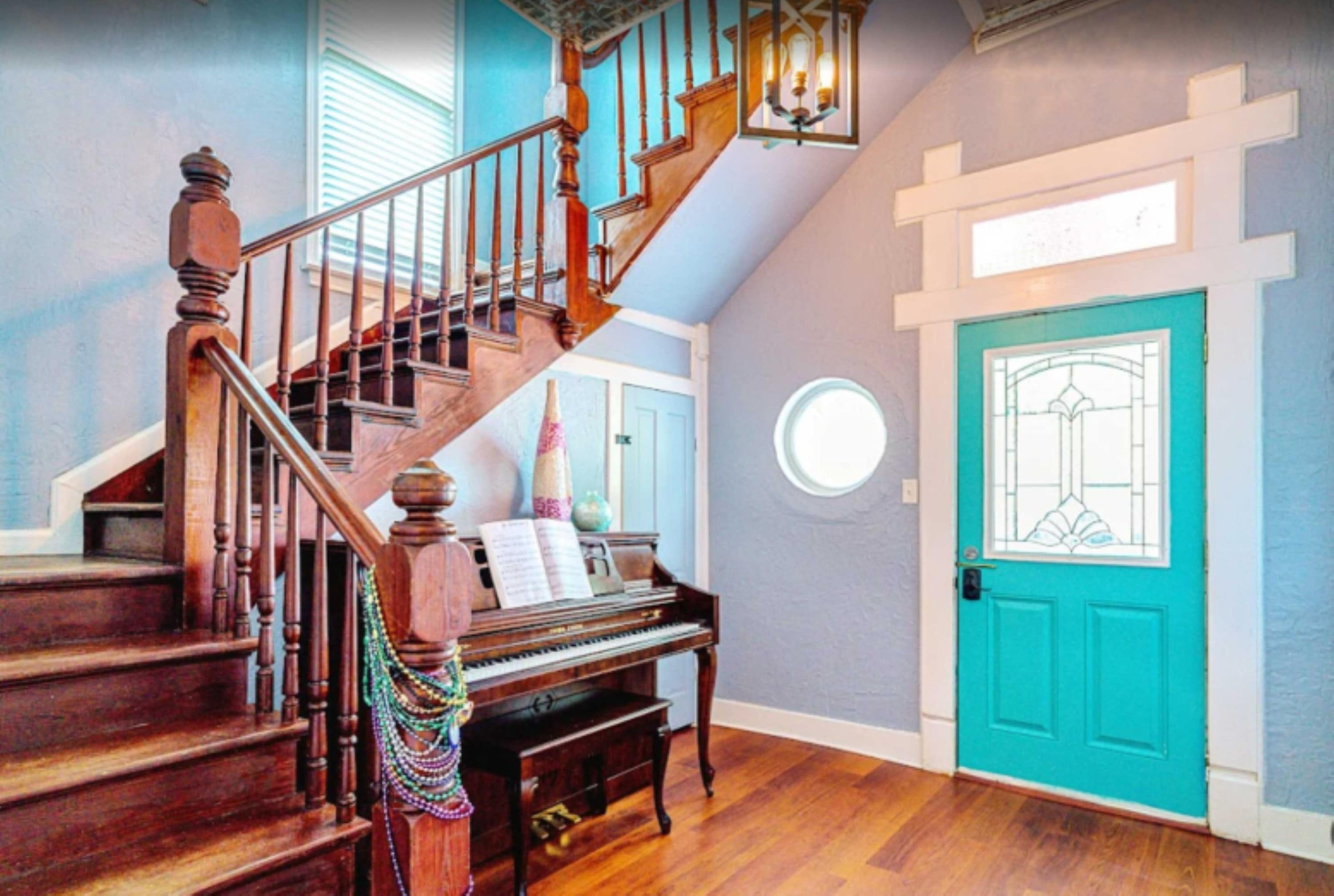 Gorgeous and welcoming entry way with a piano