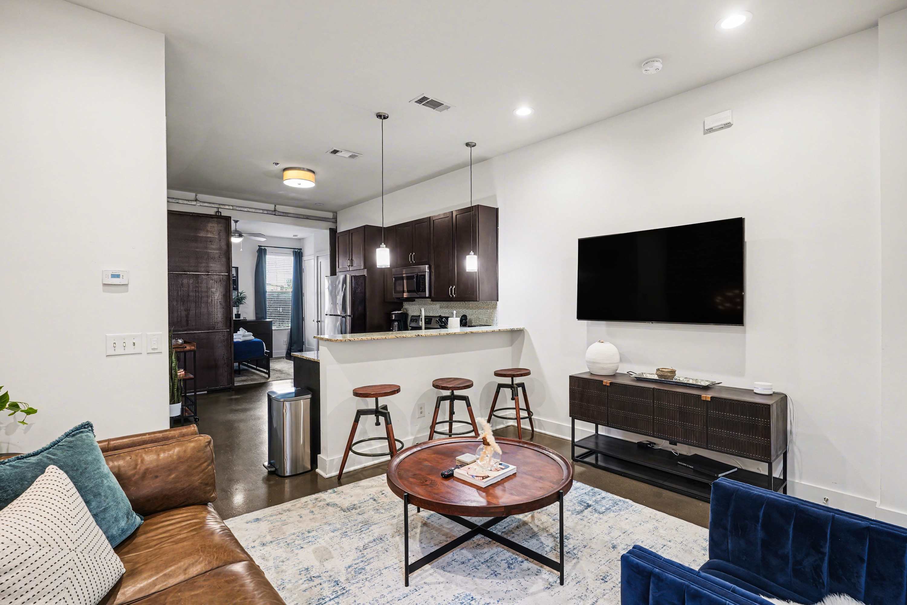 Relax in this stylish, open-concept living area.