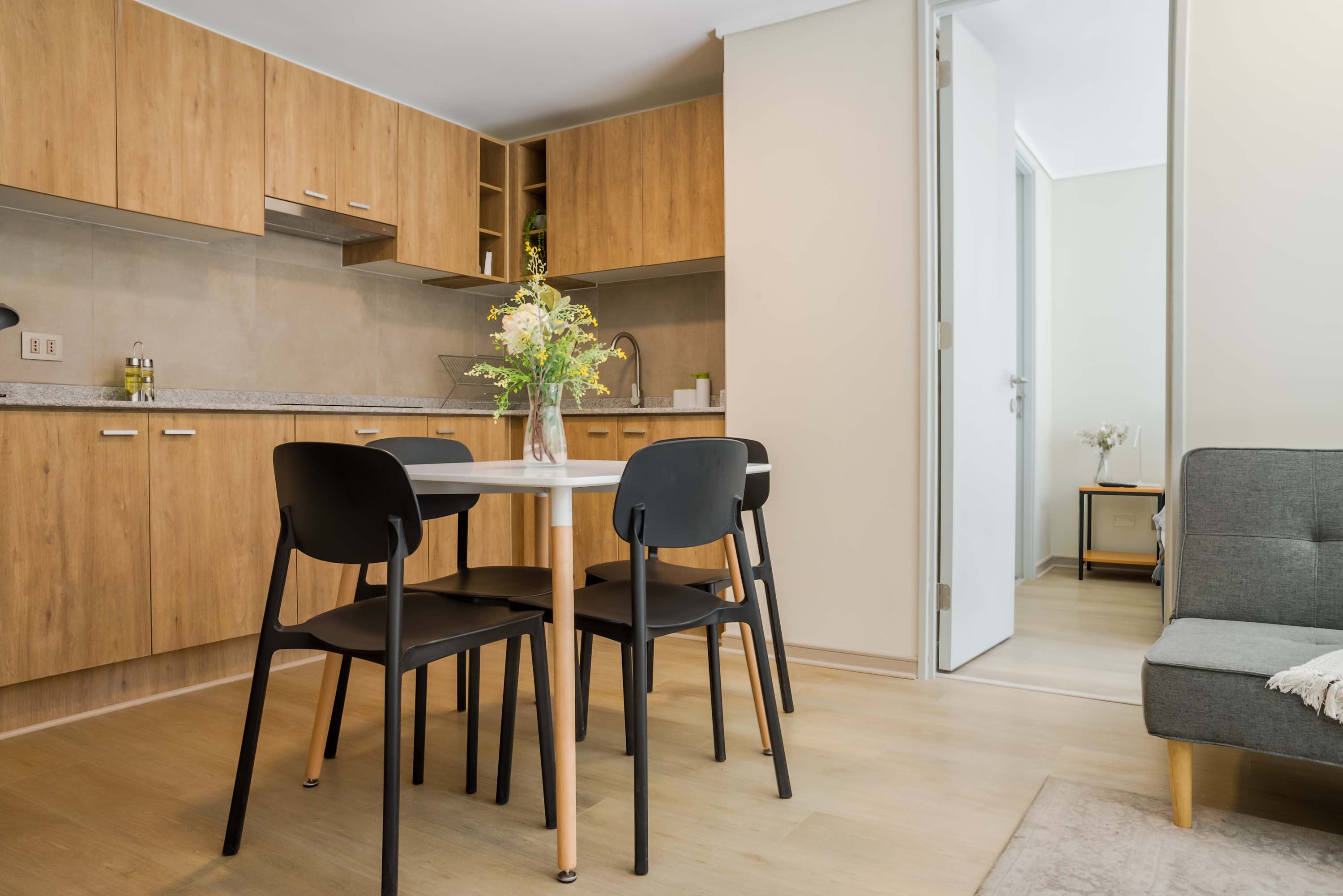 Cozy kitchen with modern amenities and a welcoming dining area, perfect for intimate meals.