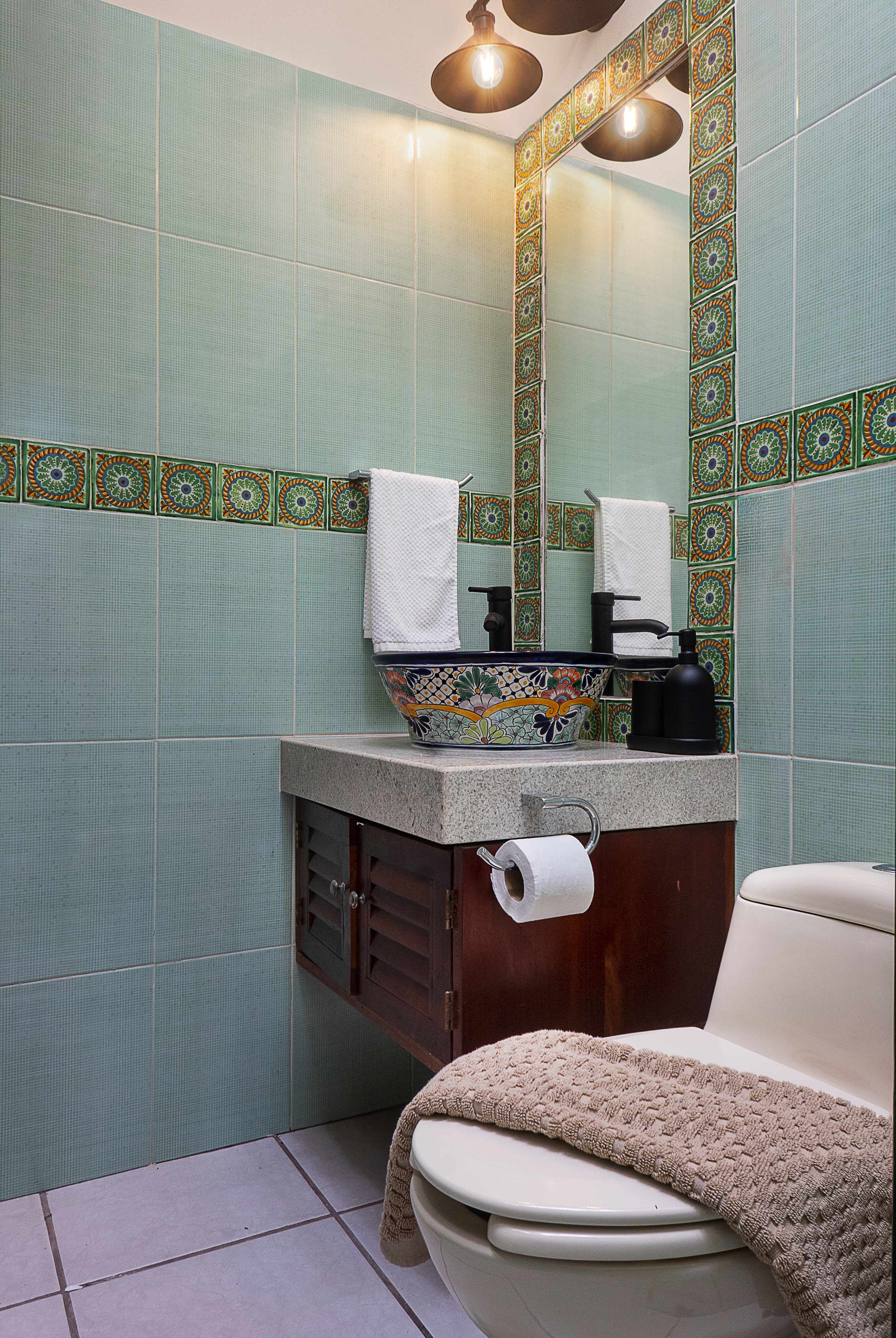 Bathroom #2 
Authentic Mexican hacienda-style bathroom showcasing hand-painted Talavera sinks, bold tilework, and artisanal finishes