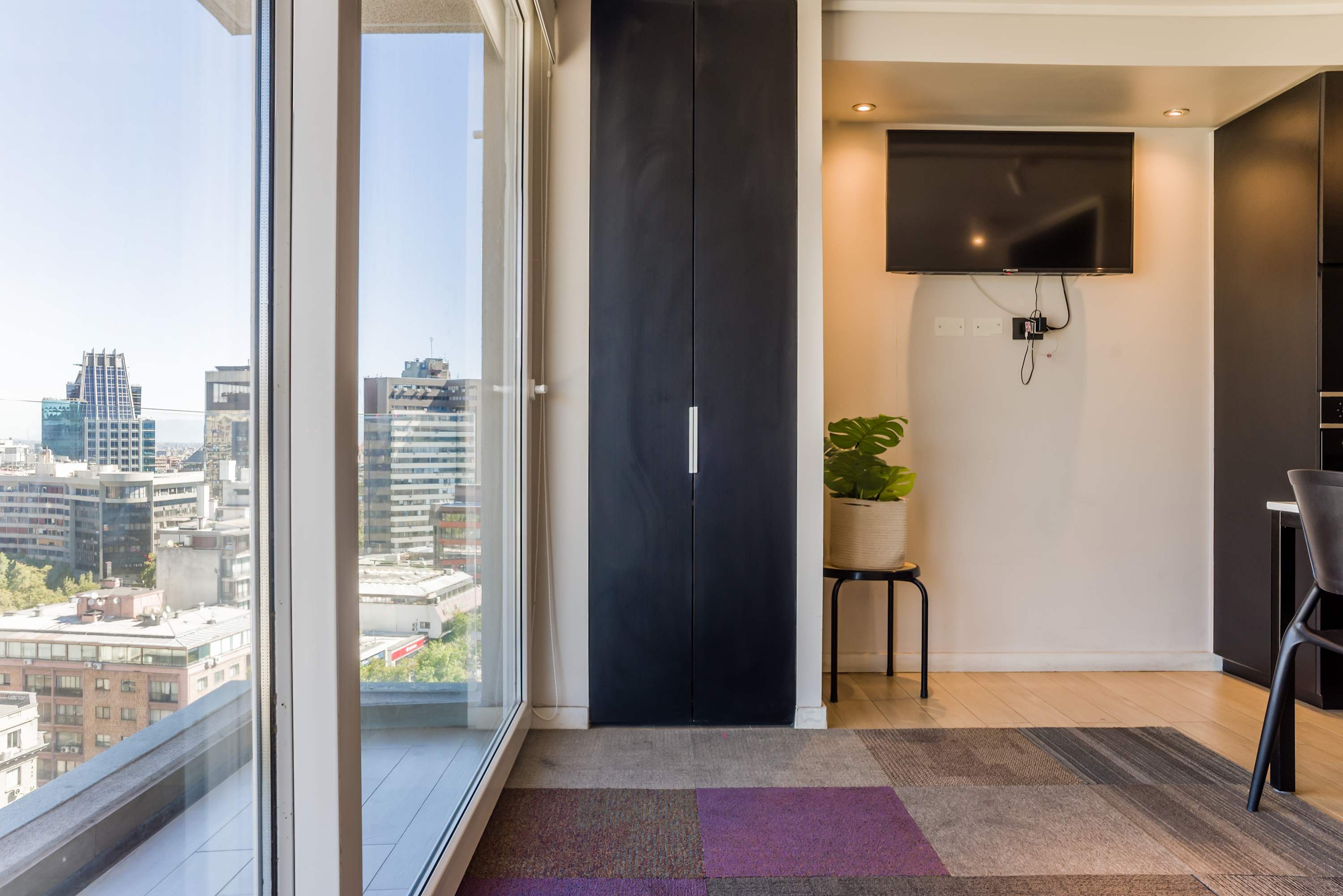 Enjoy stunning city views from this stylish studio apartment with modern amenities and a cozy atmosphere.