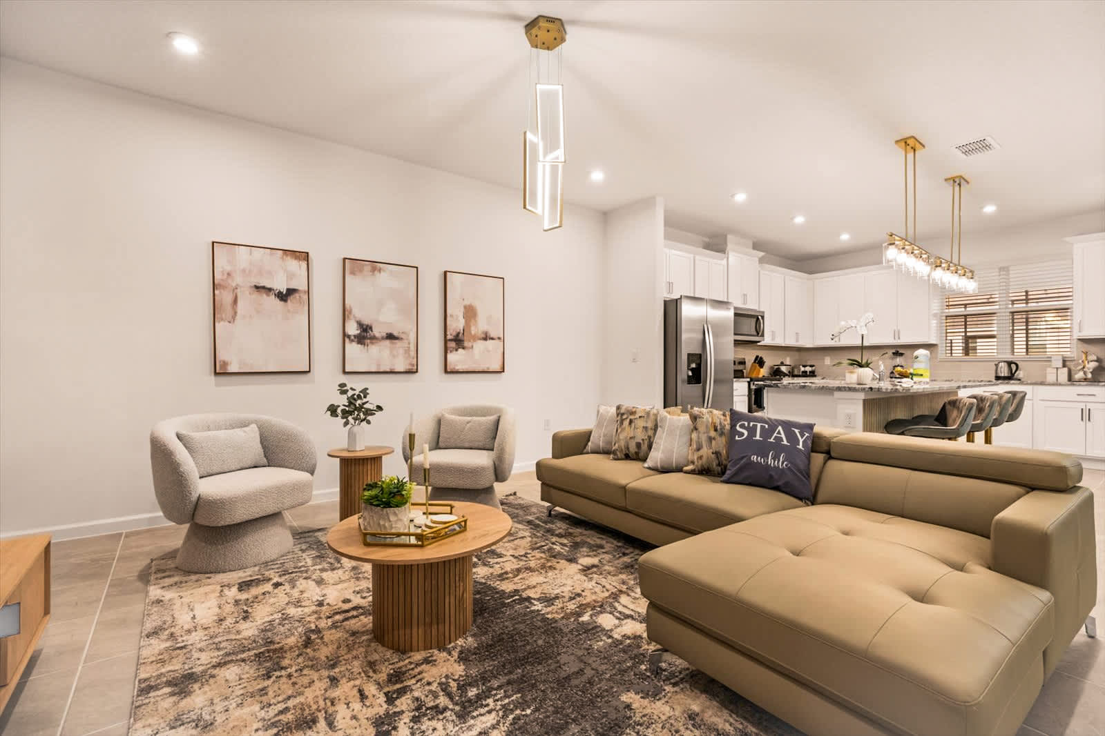 Elegant open-concept living area with modern furnishings and a cozy vibe, perfect for relaxation and entertaining.
