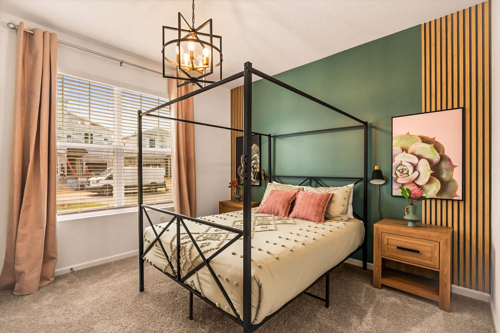 Relax in this stylish bedroom with a chic four-poster bed and soothing green accents, perfect for unwinding after a day of adventure.