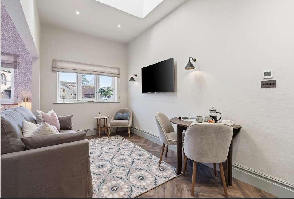 Cosy lounge with Smart TV and dining space.