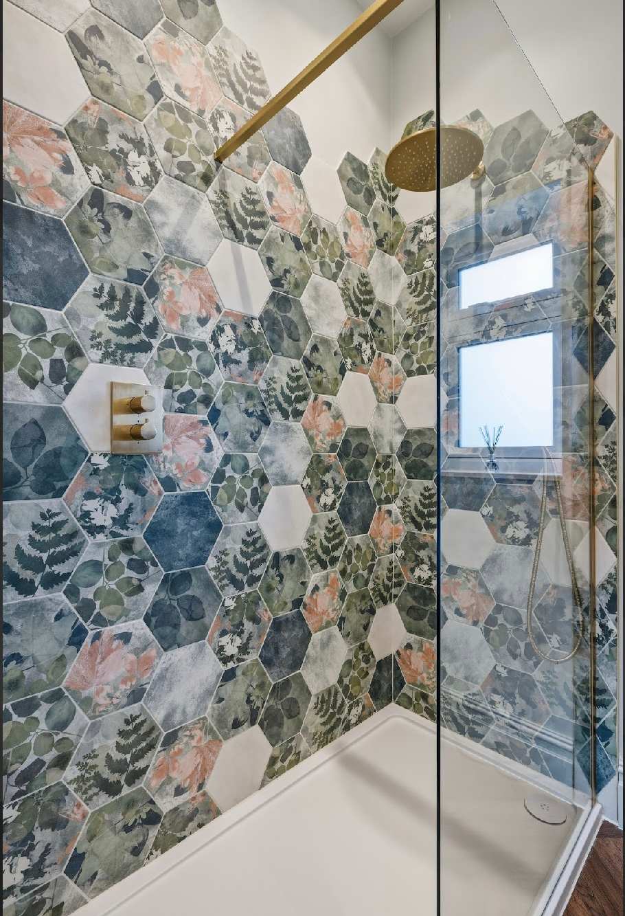 Spacious walk in shower with rainfall shower.