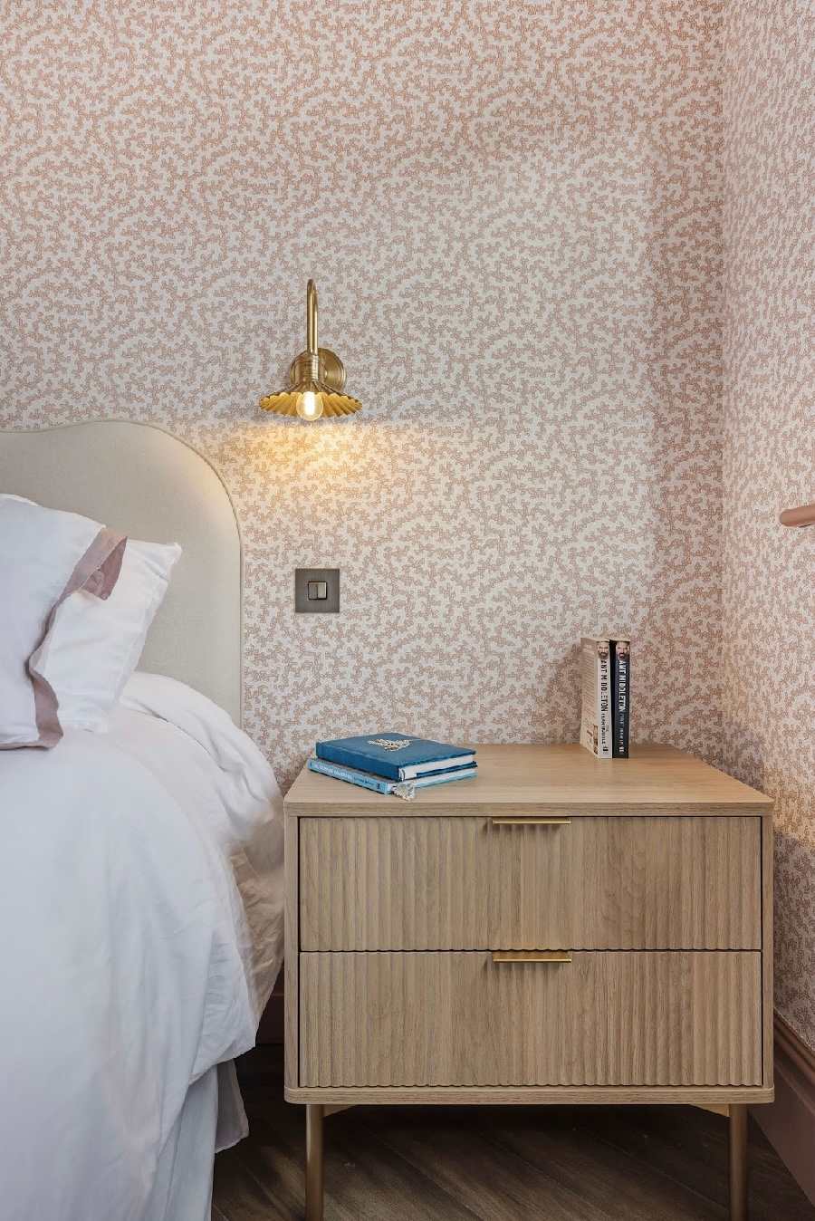 Elegant bedside details and soft lighting.