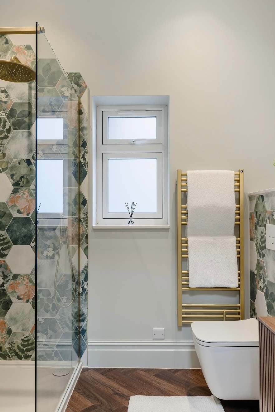 Bright and beautifully finished shower room.