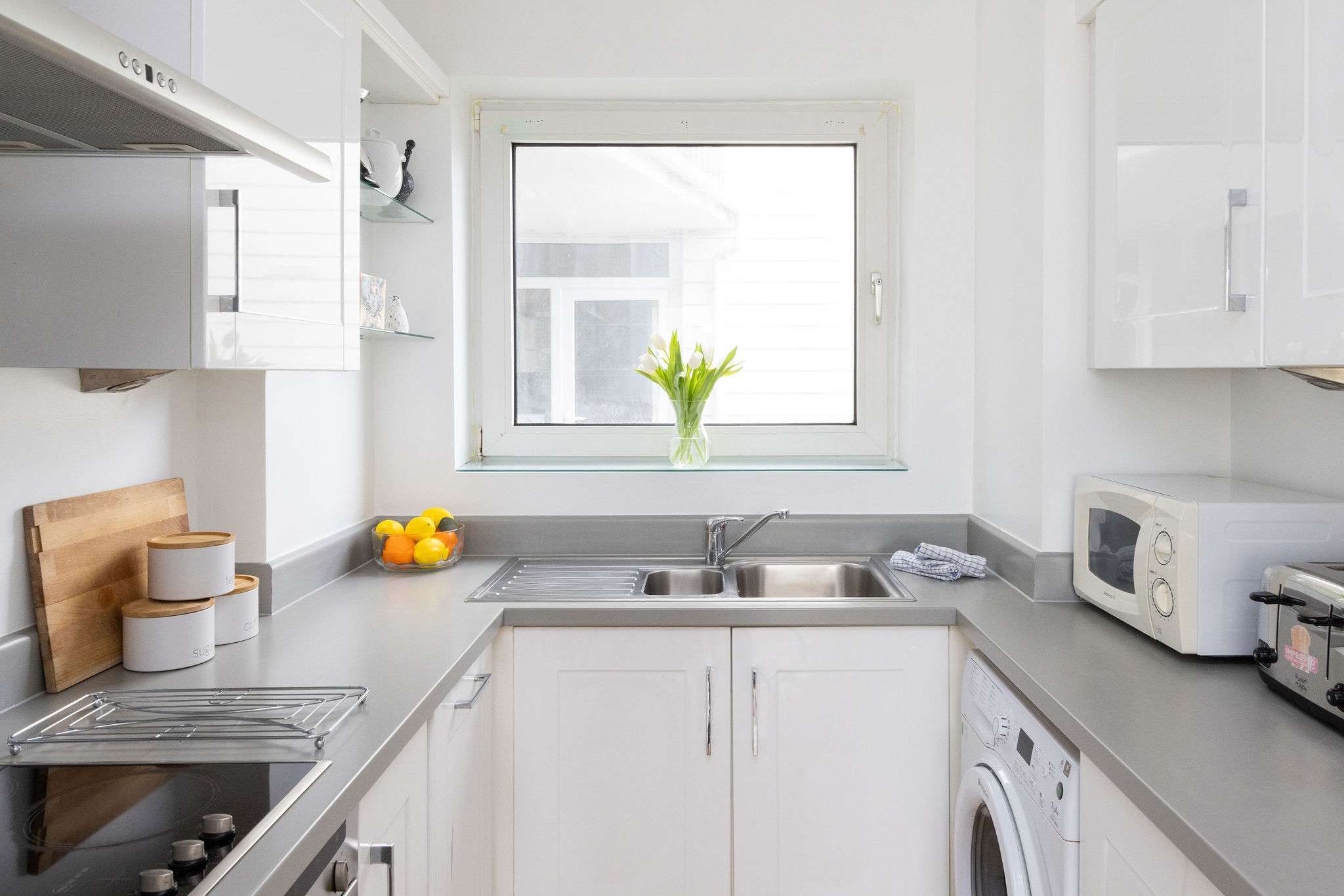 Light-filled kitchen with window views, modern appliances, and everything you need for relaxed holiday dining.