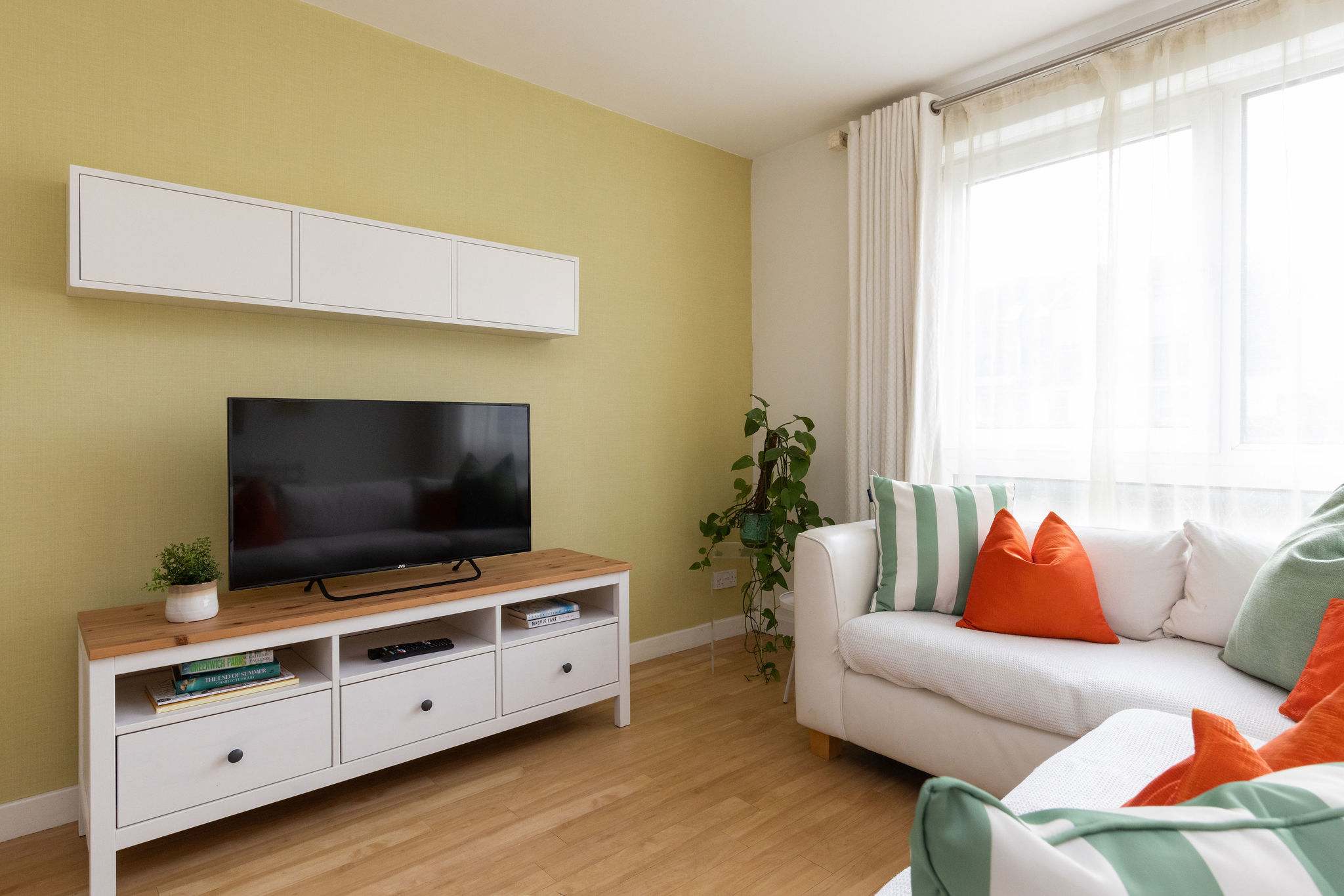 Comfortable living space with Smart TV and cosy seating, ideal for relaxing evenings in.