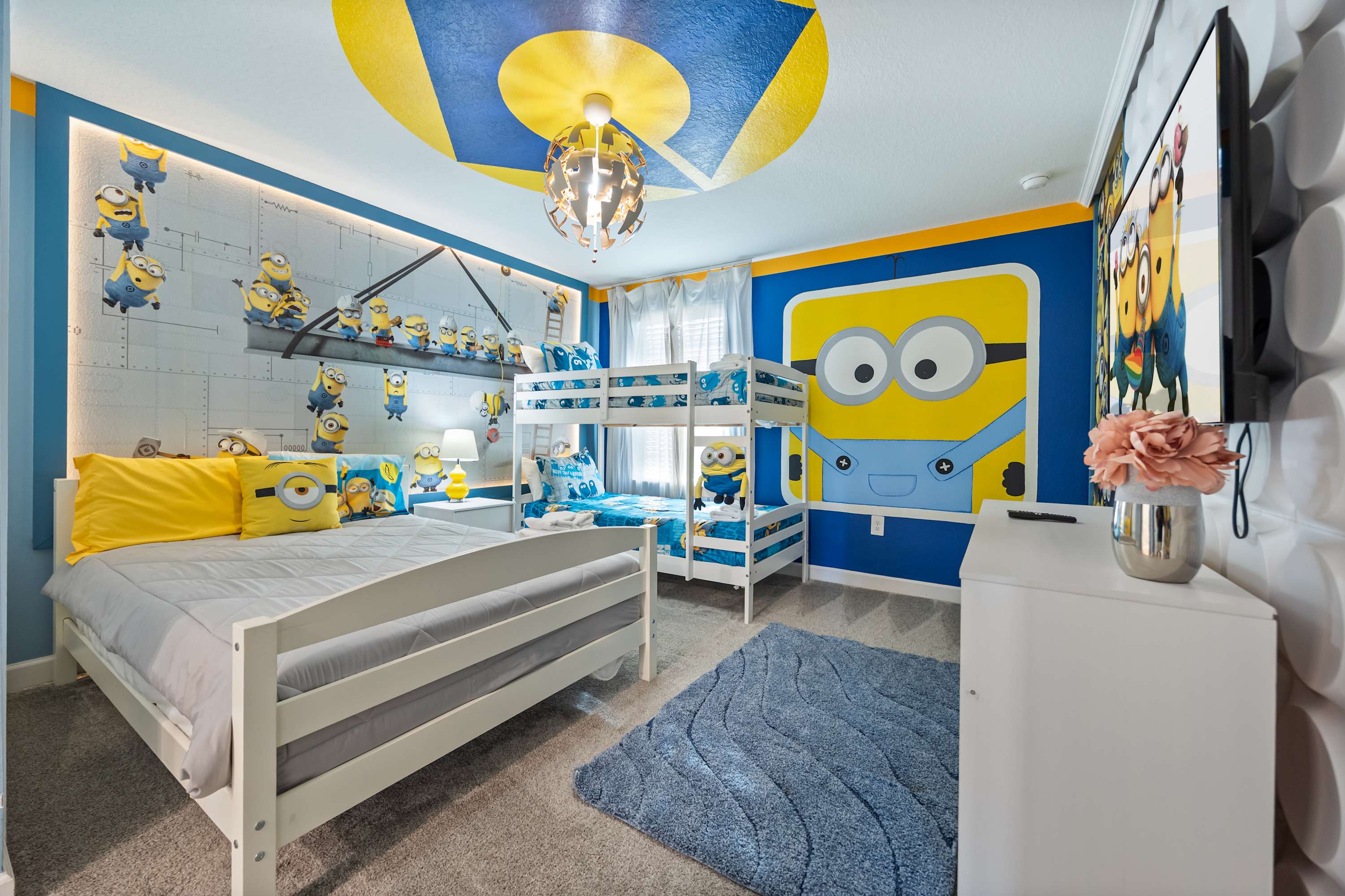 Delight in this playful Minions-themed room, perfect for kids with bunk beds and vibrant decor. A fun escape for the little ones!