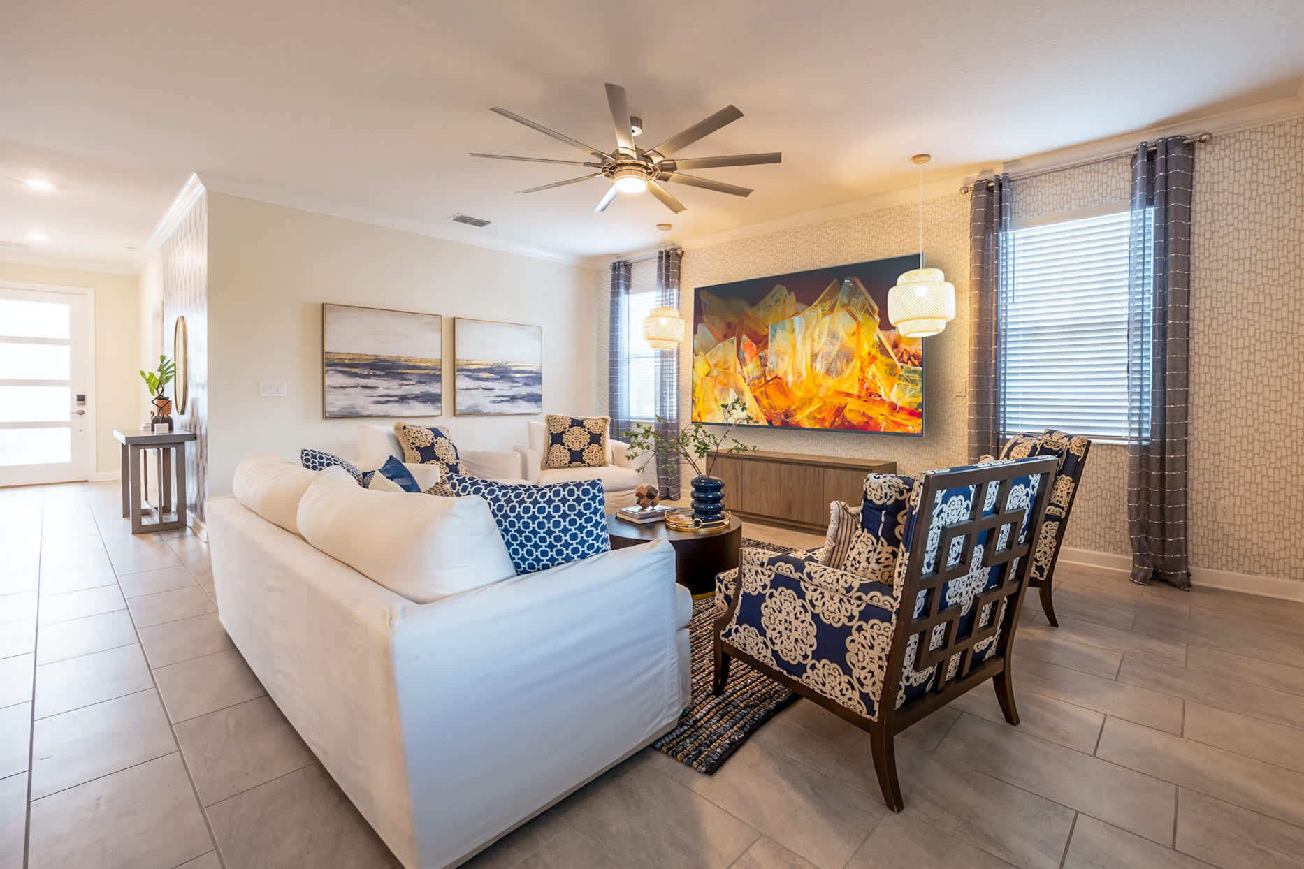Elegant living room with stylish seating and vibrant artwork, perfect for relaxation and socializing.