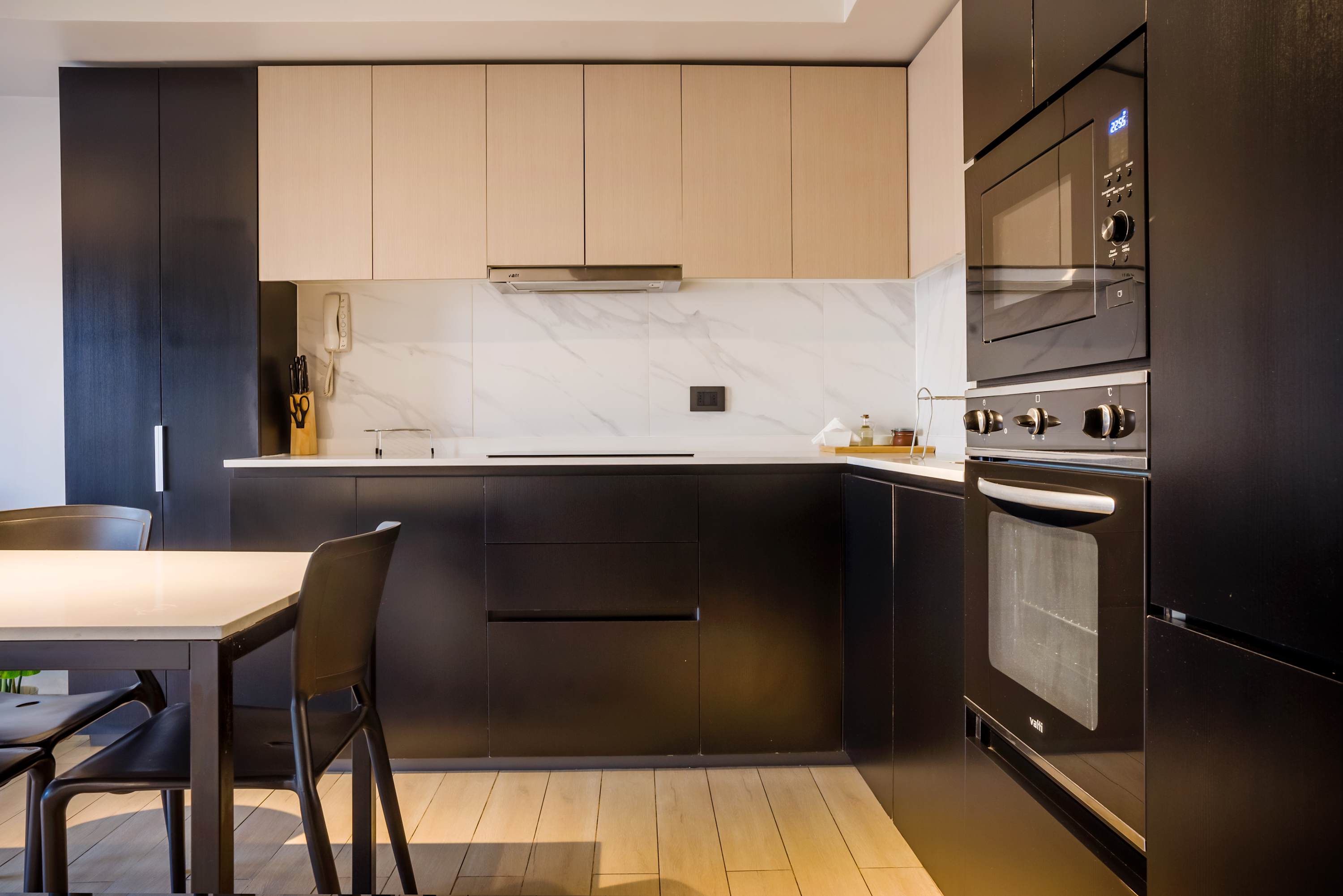 Modern kitchen with sleek appliances and elegant design, perfect for culinary enthusiasts.