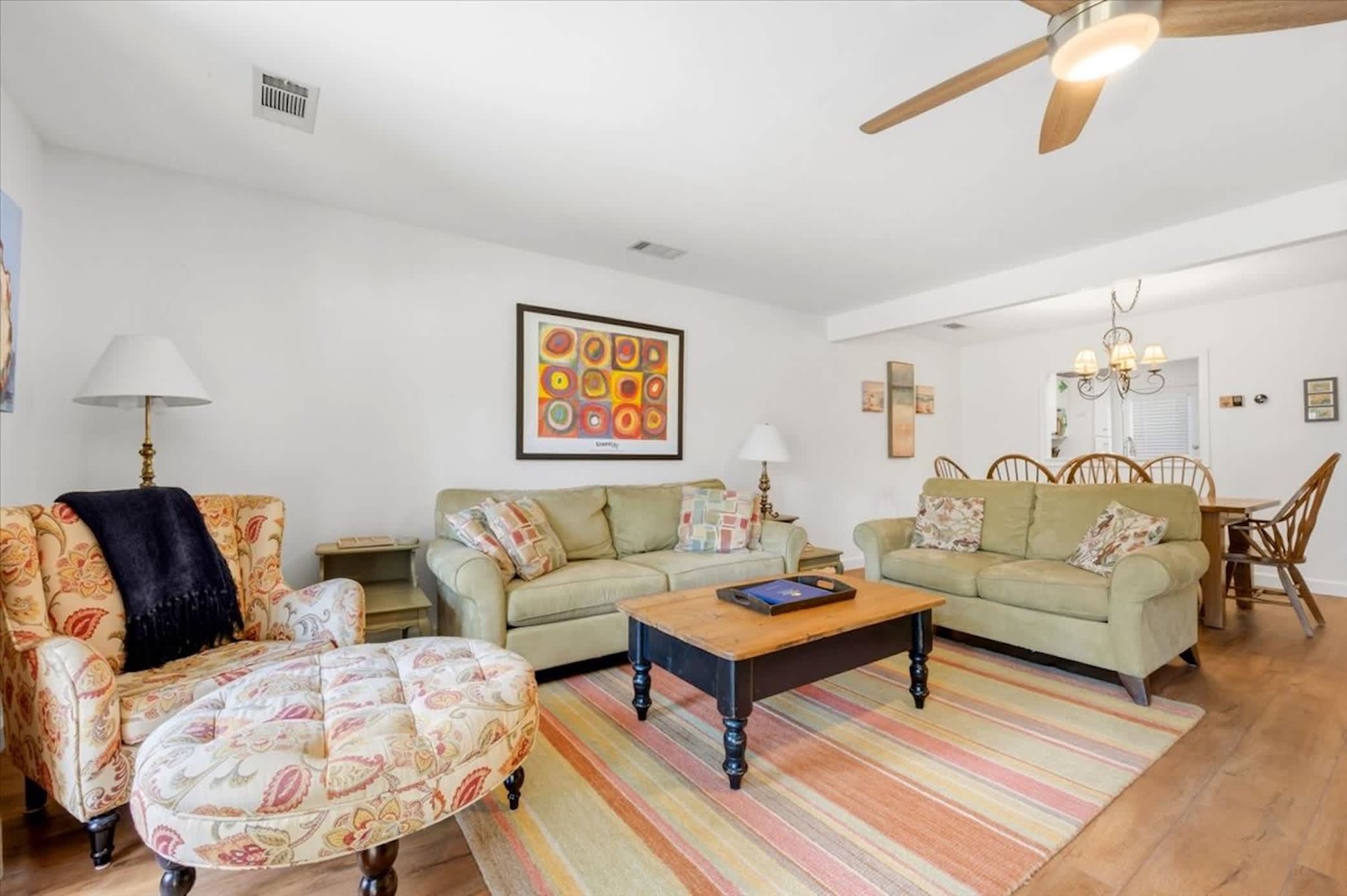 Spacious living area with smart TV and sliding door access to the private patio