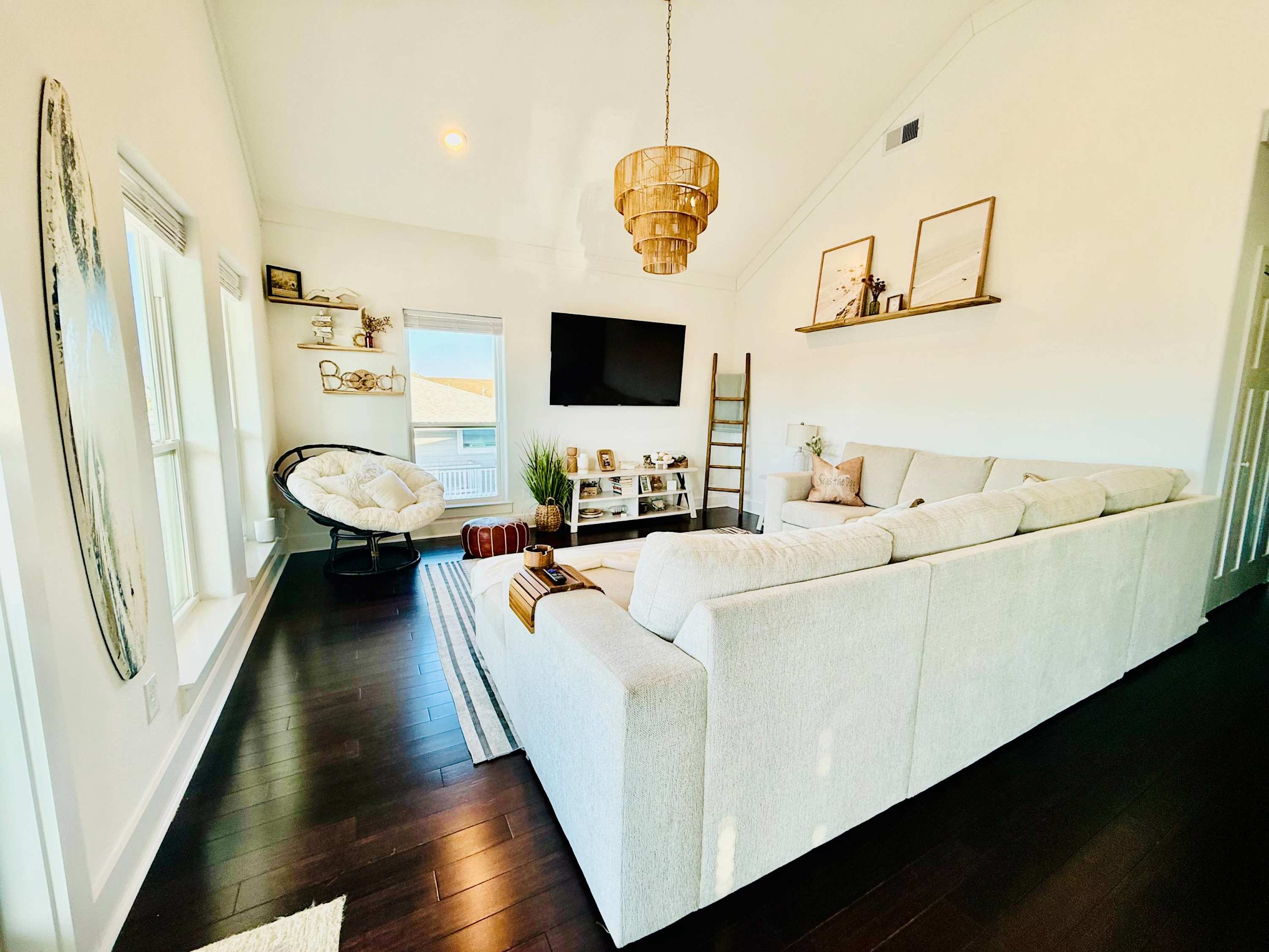 Curl up in the coastal chic living room & enjoy a movie night at home​