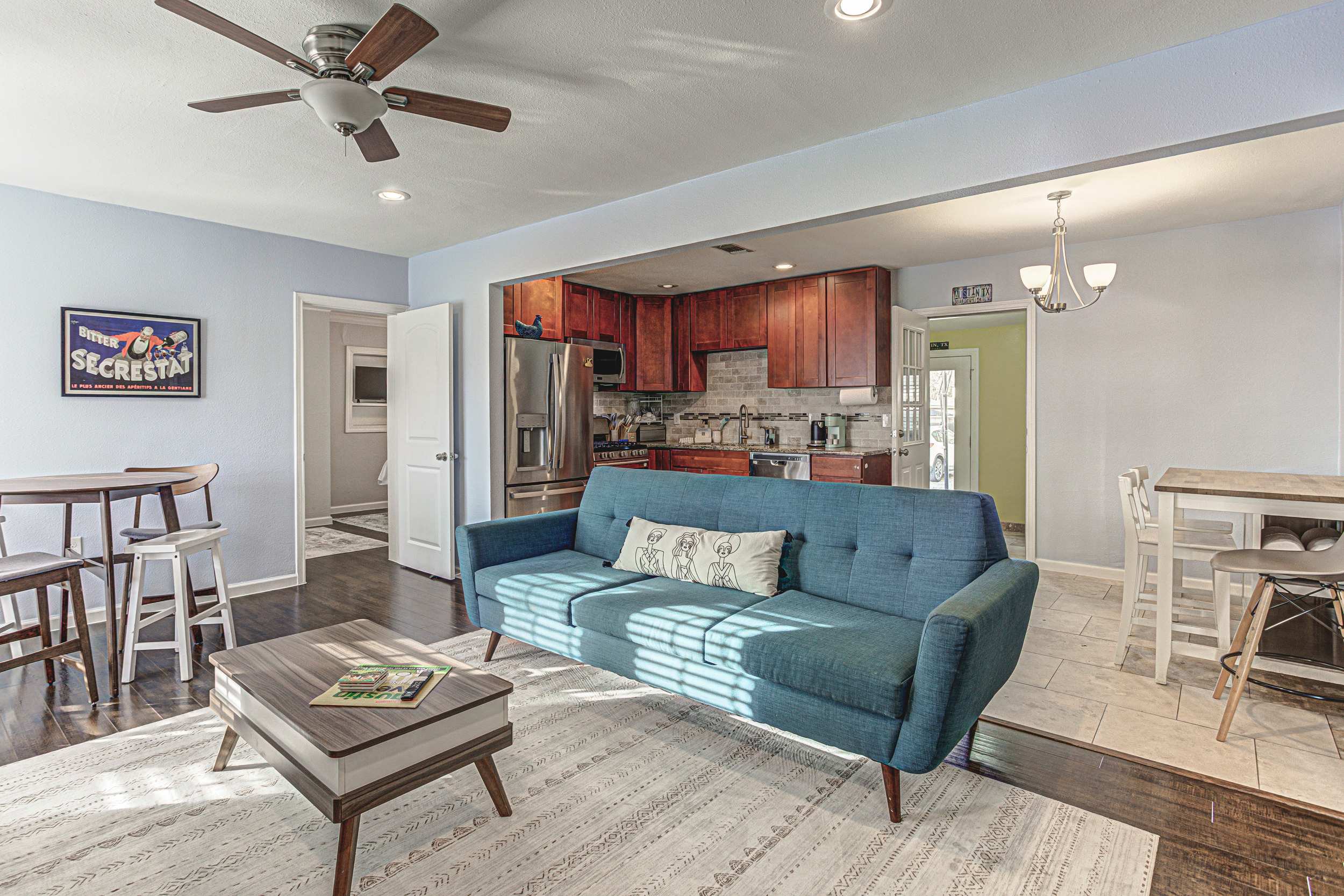 Modern living room with a sleek blue sofa.