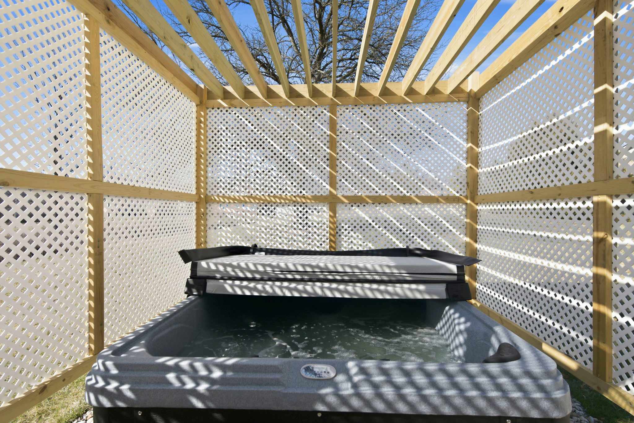 Soak, unwind, and enjoy the privacy of an enclosed hot tub