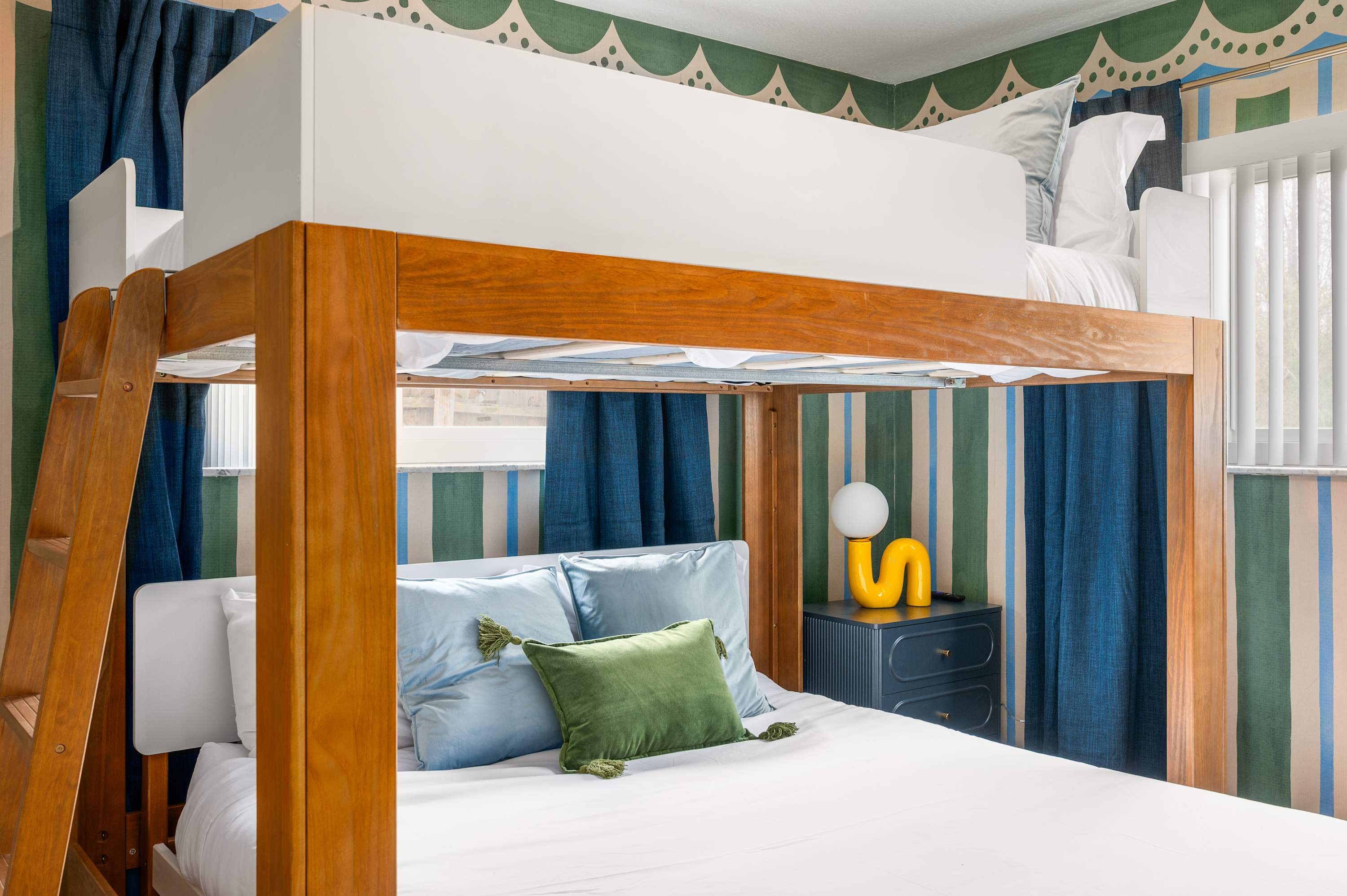 Cozy bunk nook w/ built-in bunks & fresh white bedding.