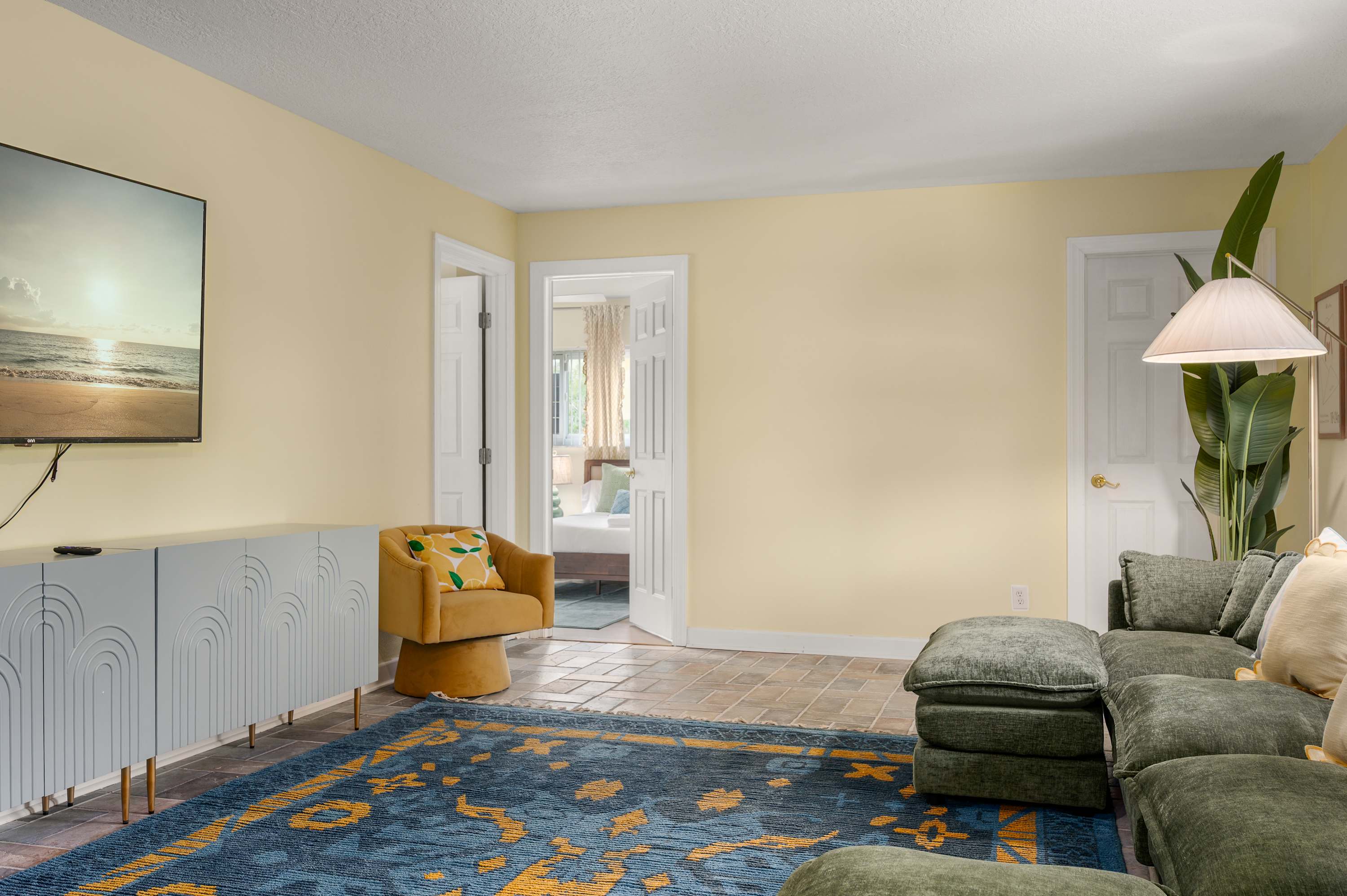 Relaxed living room w/ sofa, warm tones & casual everyday comfort.