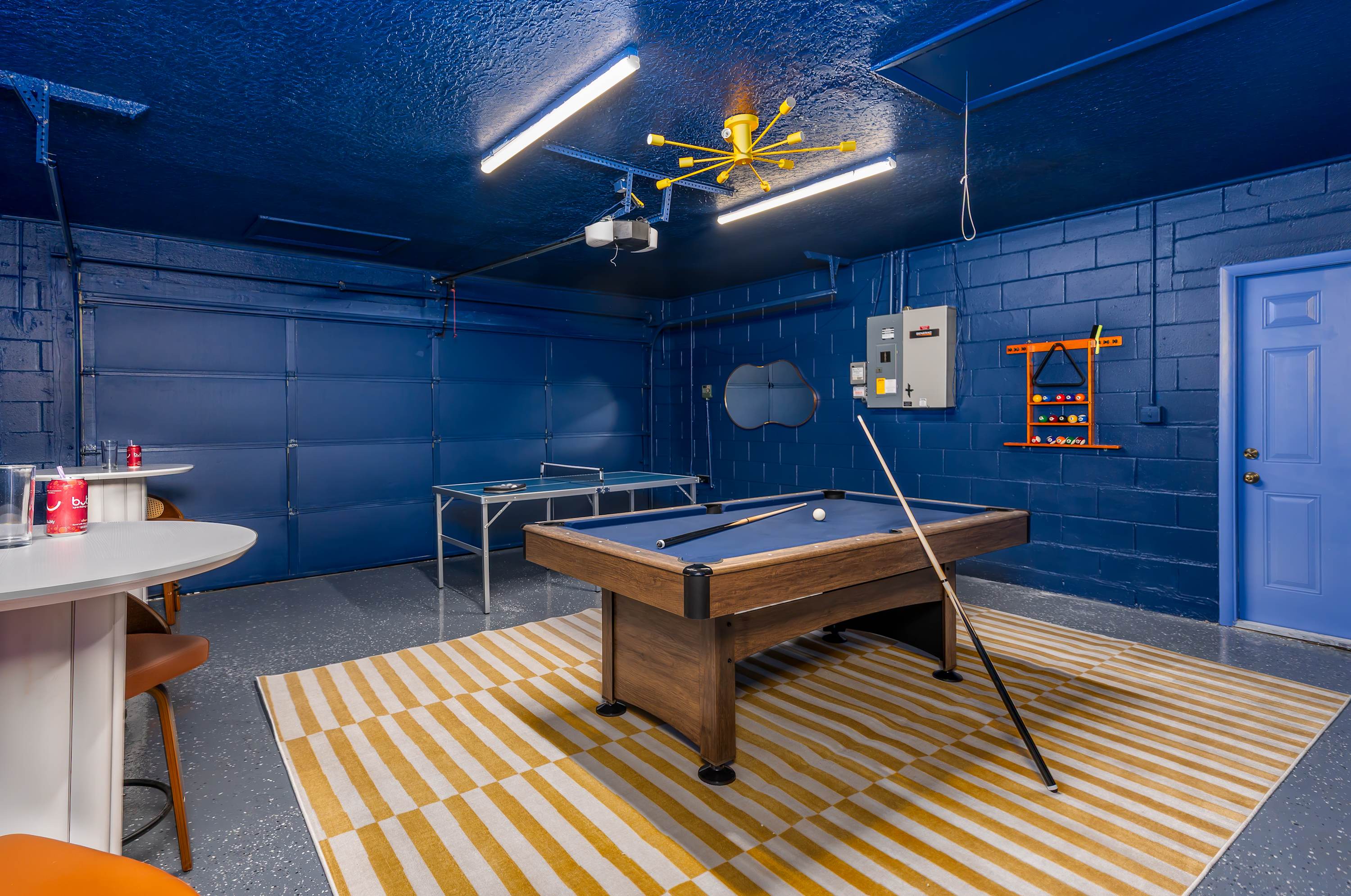 Game room w/ pool table, blue walls & plenty of space for a fun group night.